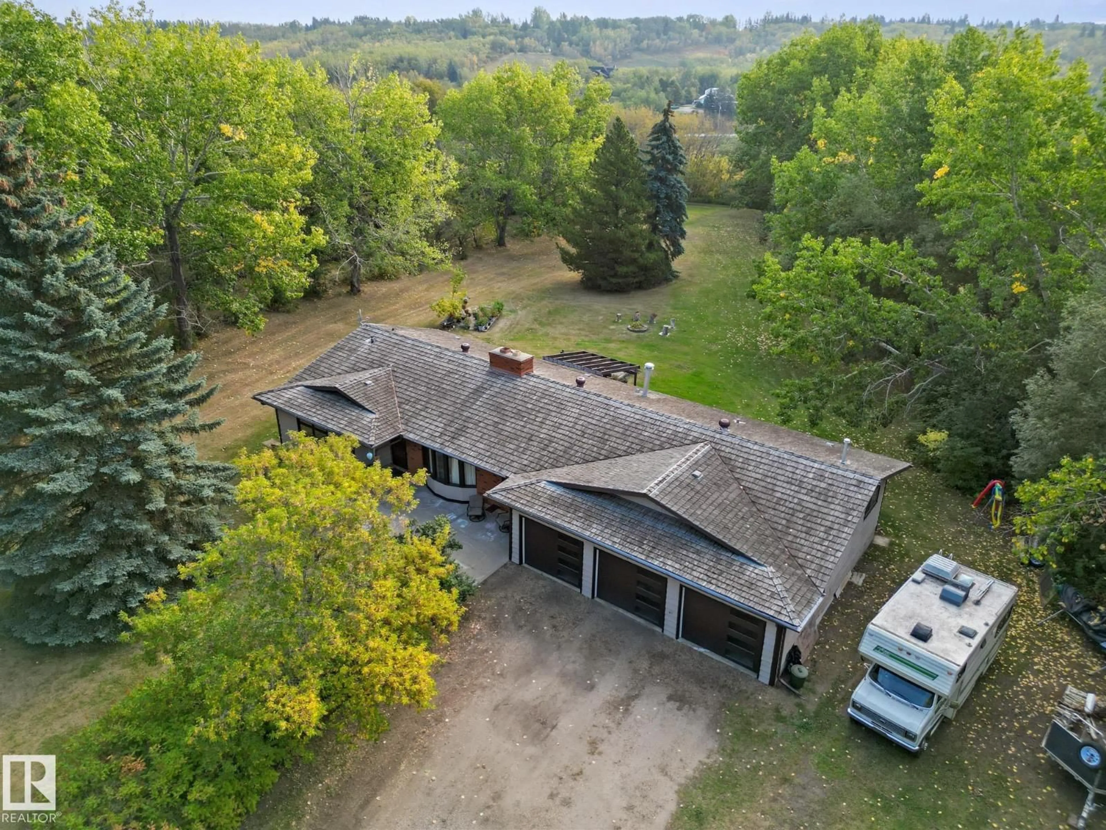 A pic from outside/outdoor area/front of a property/back of a property/a pic from drone, unknown for #103 - 24213 TWP ROAD 554, Rural Sturgeon County Alberta T8T1X9