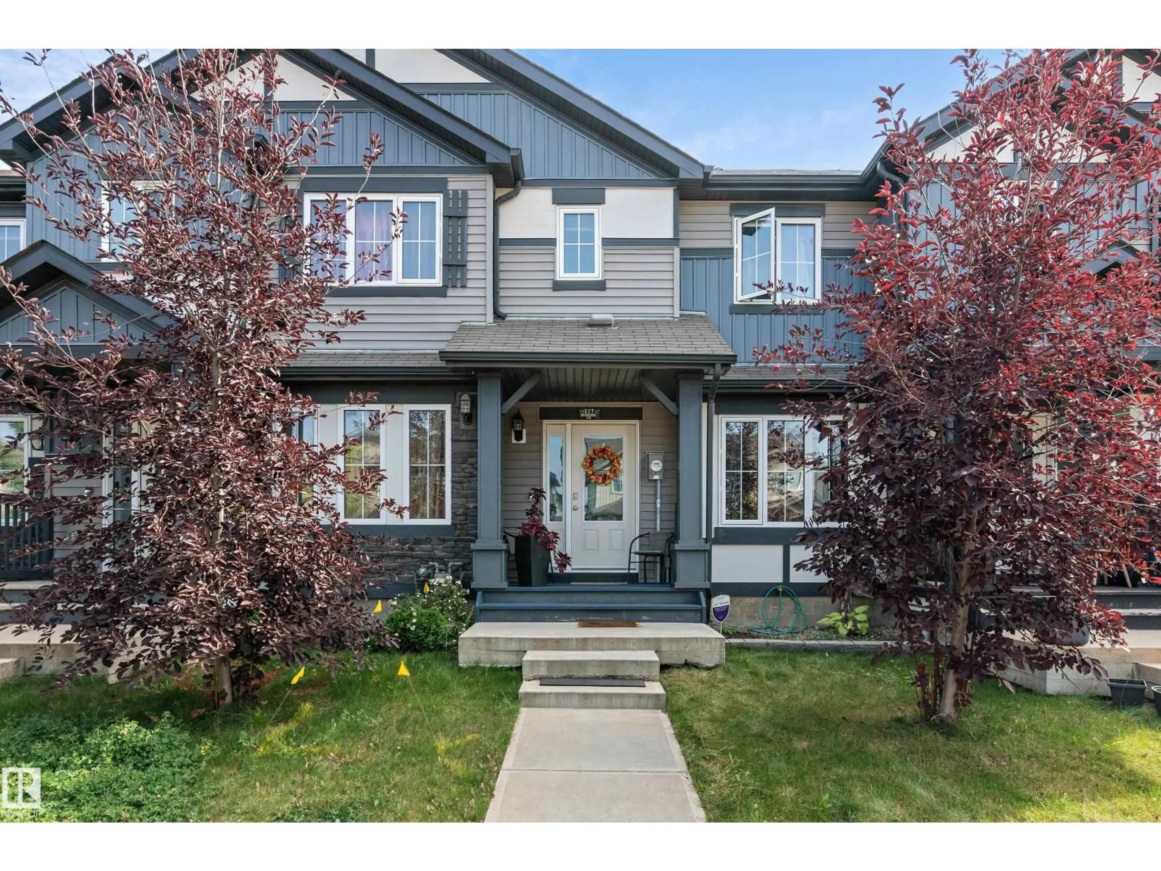 Home with vinyl exterior material, street for 327 DESROCHERS BV, Edmonton Alberta T6W3J1
