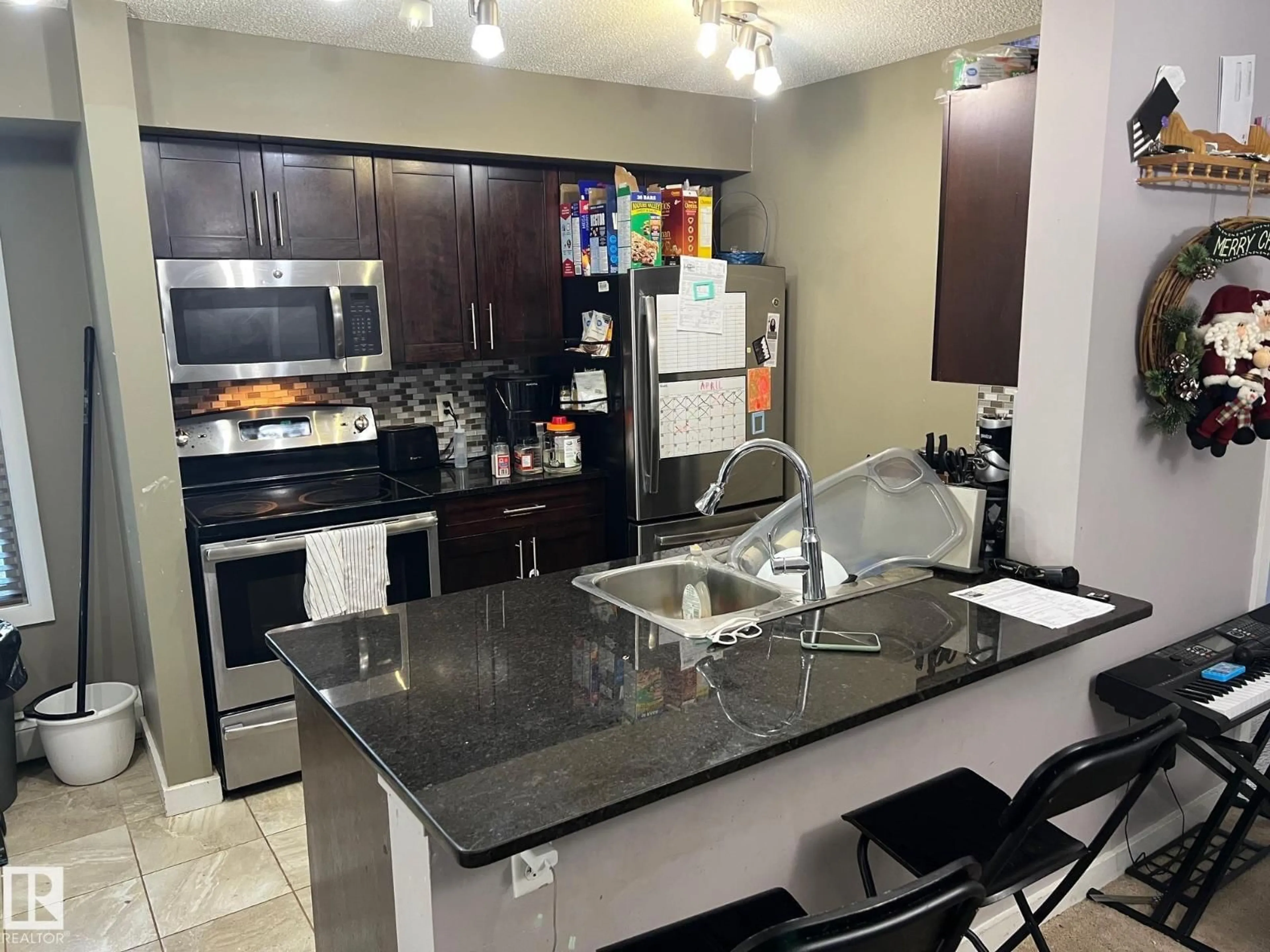 Open concept kitchen, ceramic/tile floor for 107 - 101 WATT CM, Edmonton Alberta T6X2C6