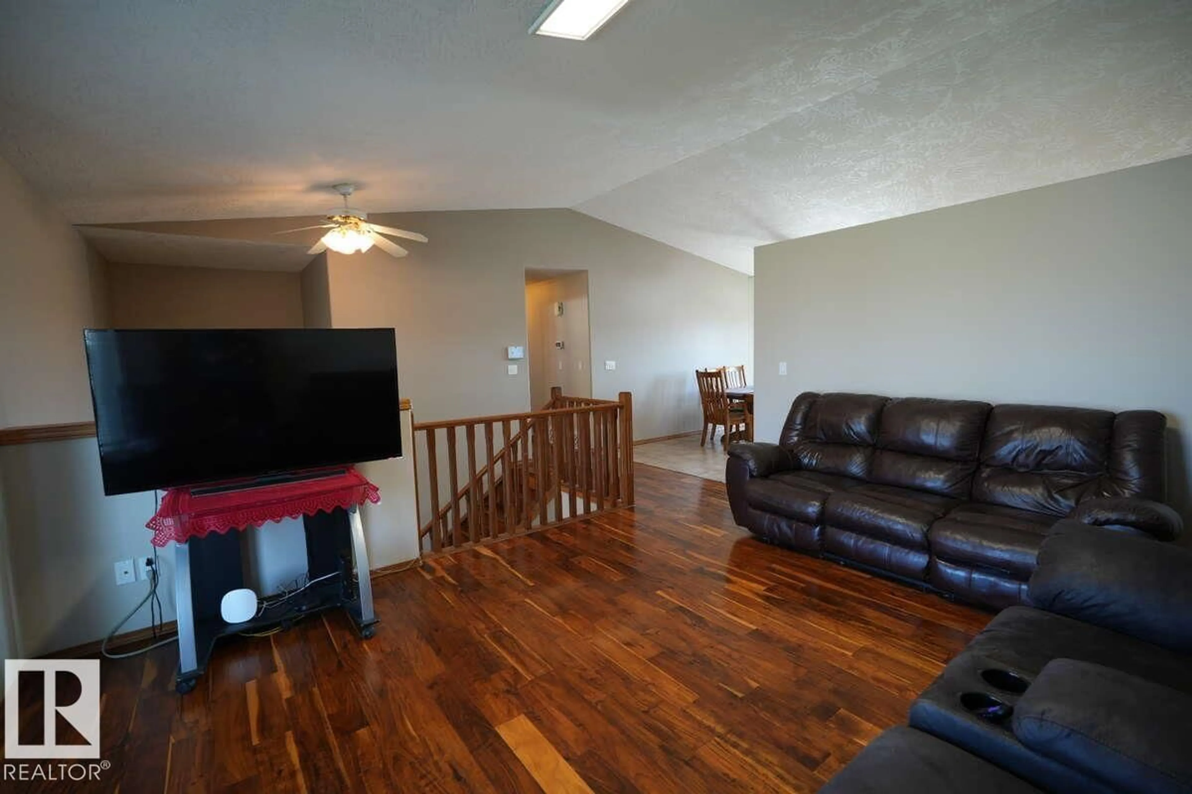 Living room with furniture, wood/laminate floor for 3608 42 AV, Bonnyville Town Alberta T9N2J8