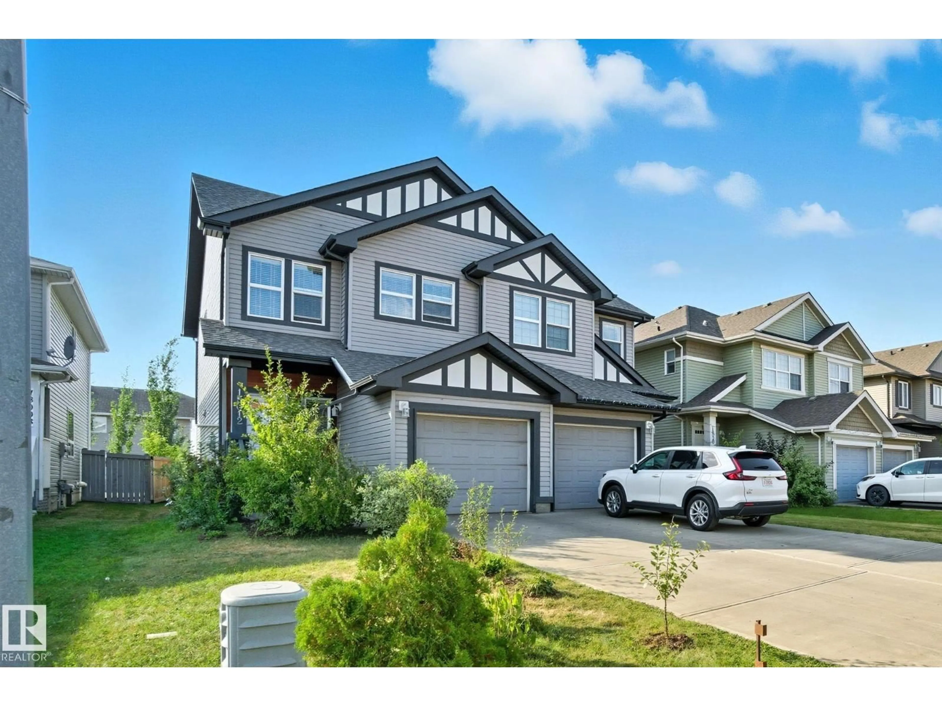 Home with vinyl exterior material, street for 18012 85 ST, Edmonton Alberta T5Z0E4