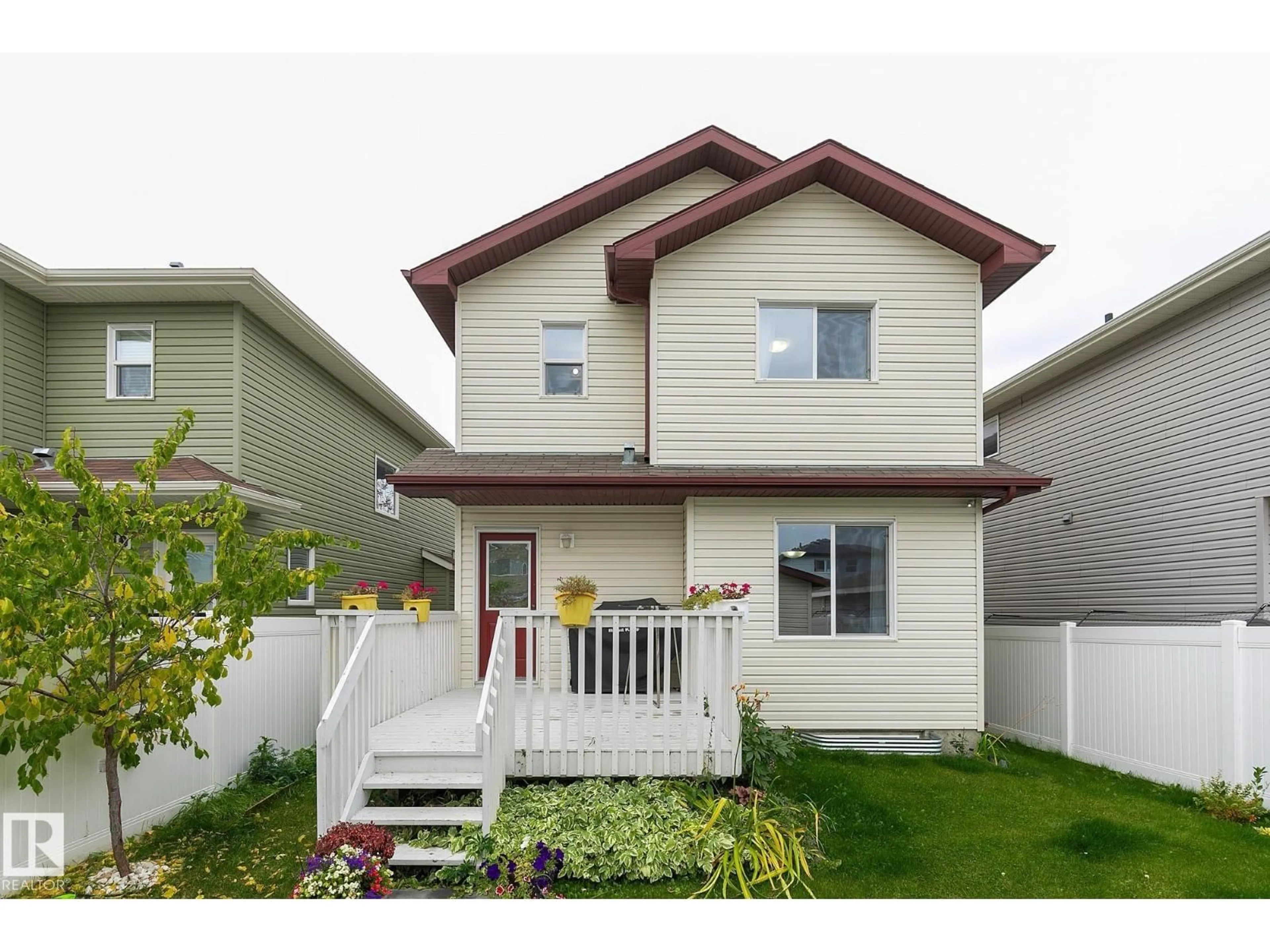 Home with vinyl exterior material, street for NW - 8740 180 AV, Edmonton Alberta T5Z0E3