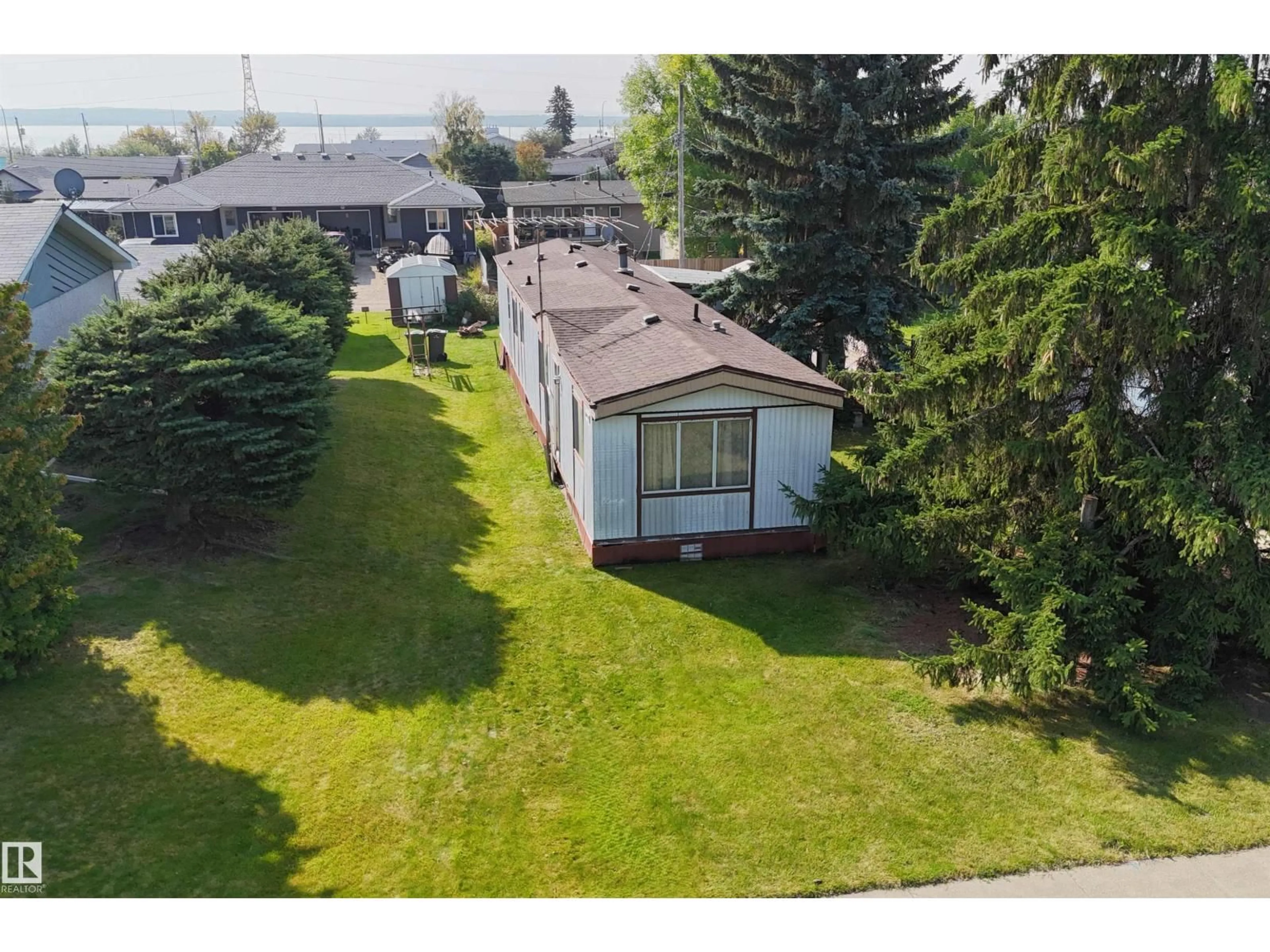 A pic from outside/outdoor area/front of a property/back of a property/a pic from drone, unknown for 5231 53 AV, Wabamun Alberta T0E2K0
