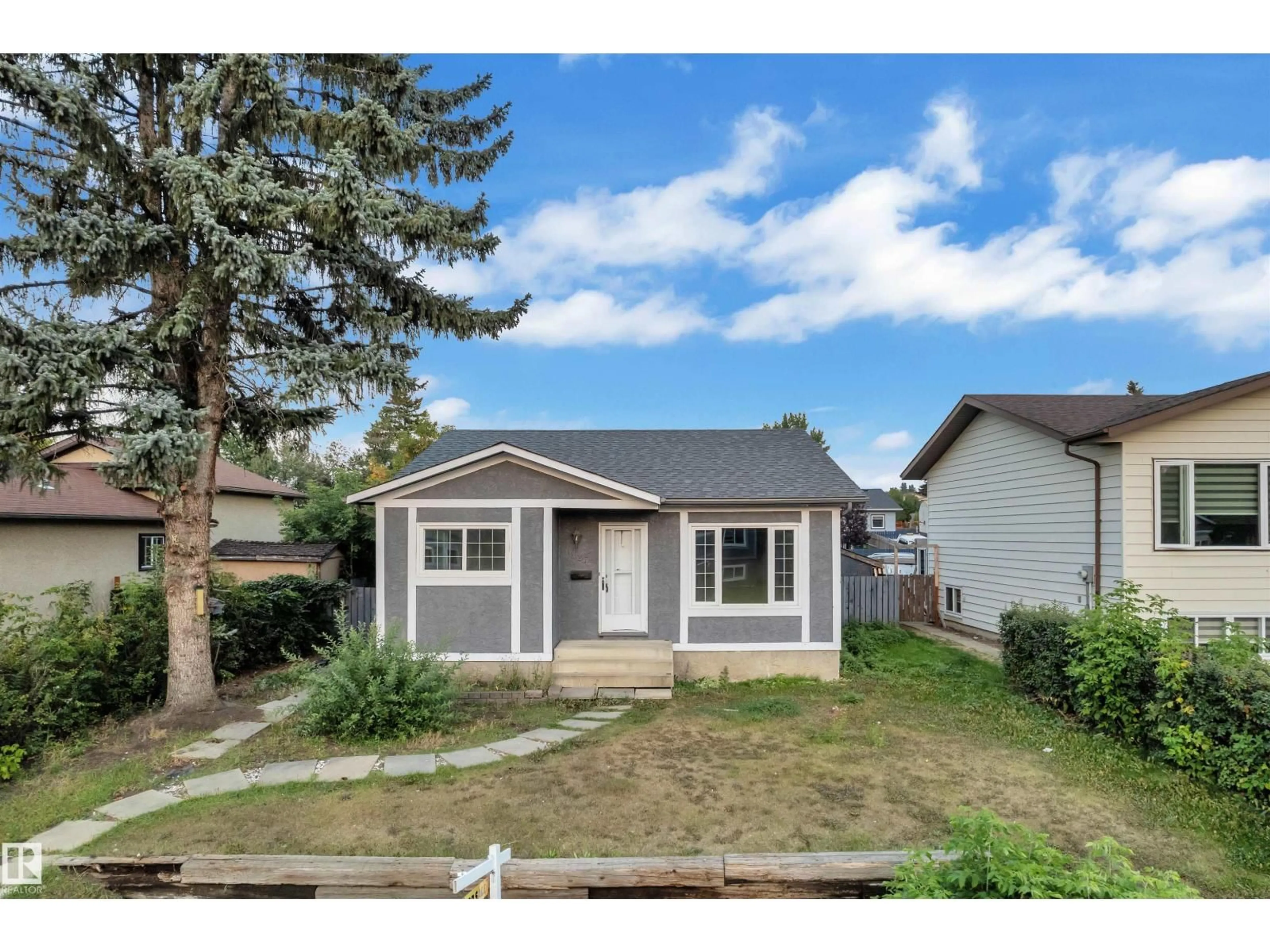 Home with vinyl exterior material, street for 1027 61 ST, Edmonton Alberta T6L3W2