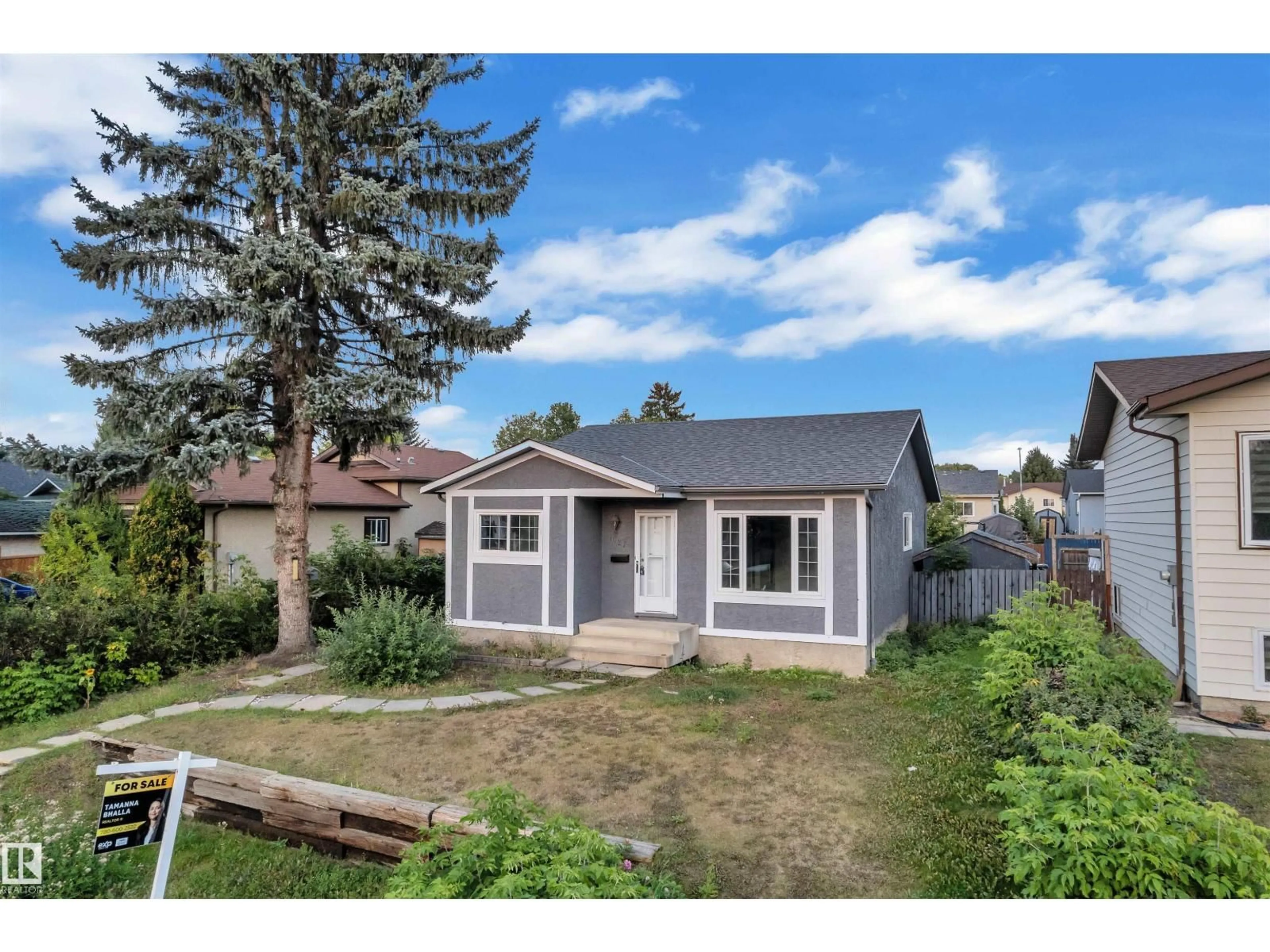 Home with vinyl exterior material, street for 1027 61 ST, Edmonton Alberta T6L3W2