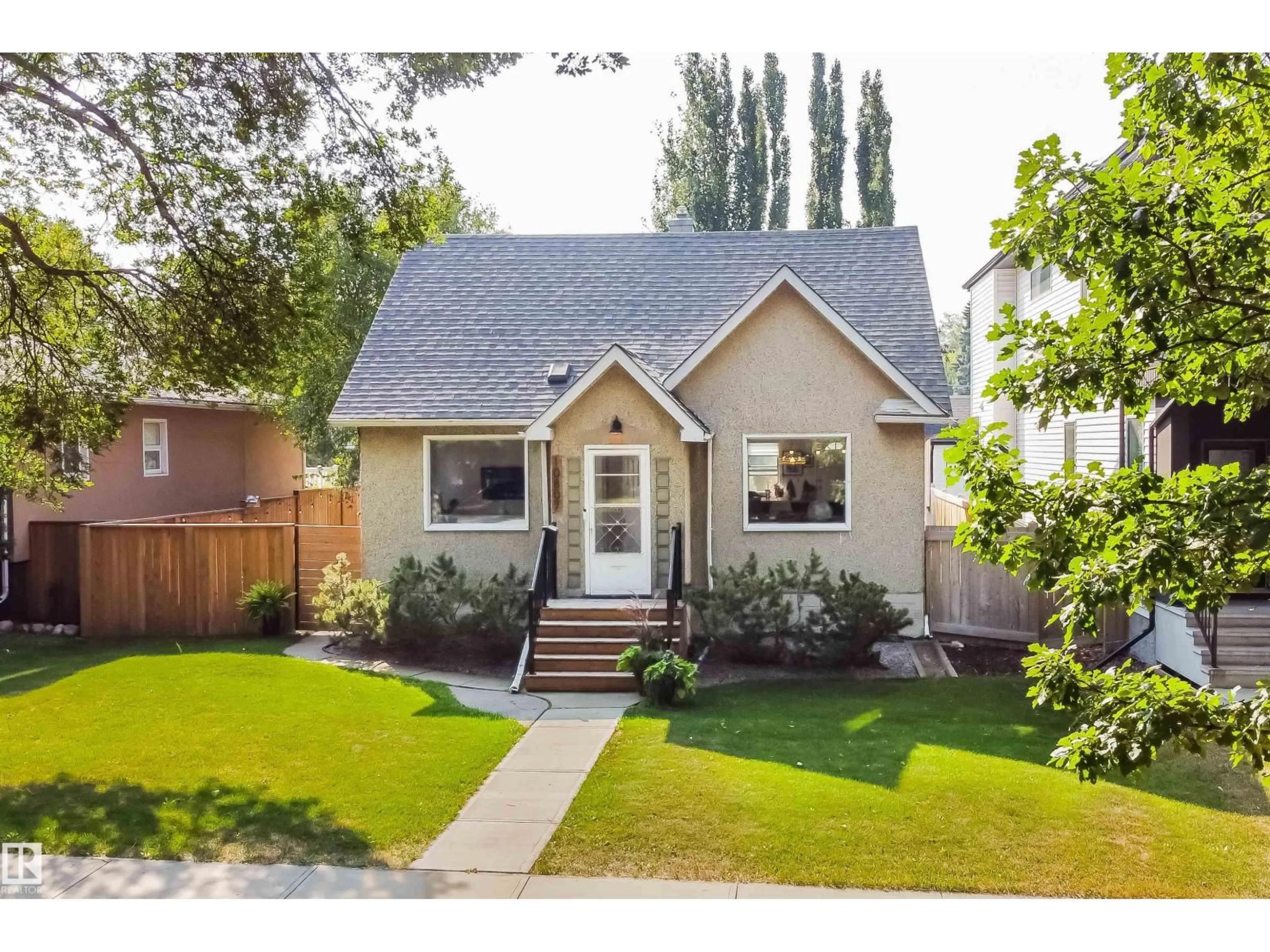 Home with vinyl exterior material, street for 10807 63 AV, Edmonton Alberta T6H1P9