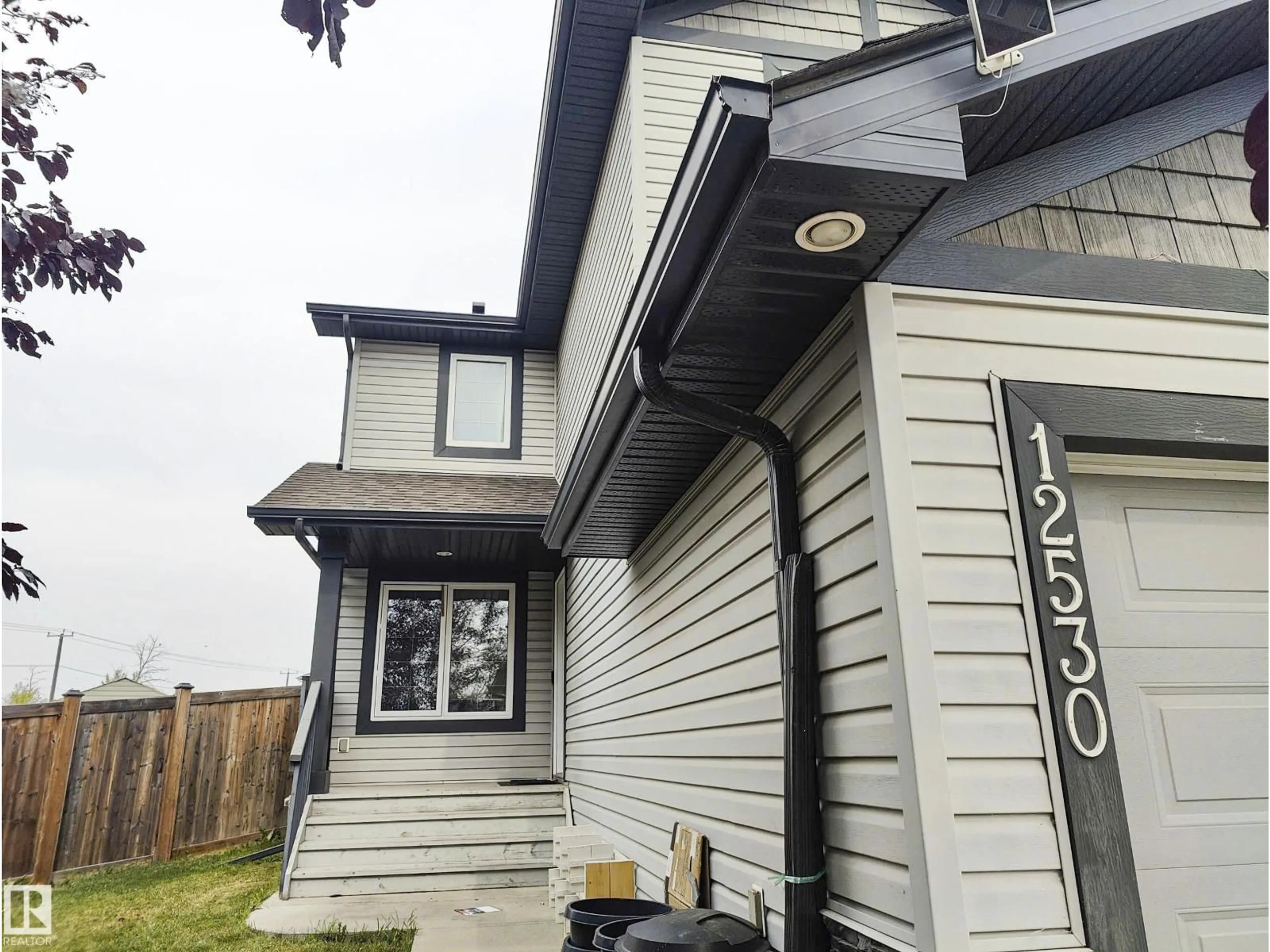 Home with vinyl exterior material, street for 12530 172 AV, Edmonton Alberta T5X0E6