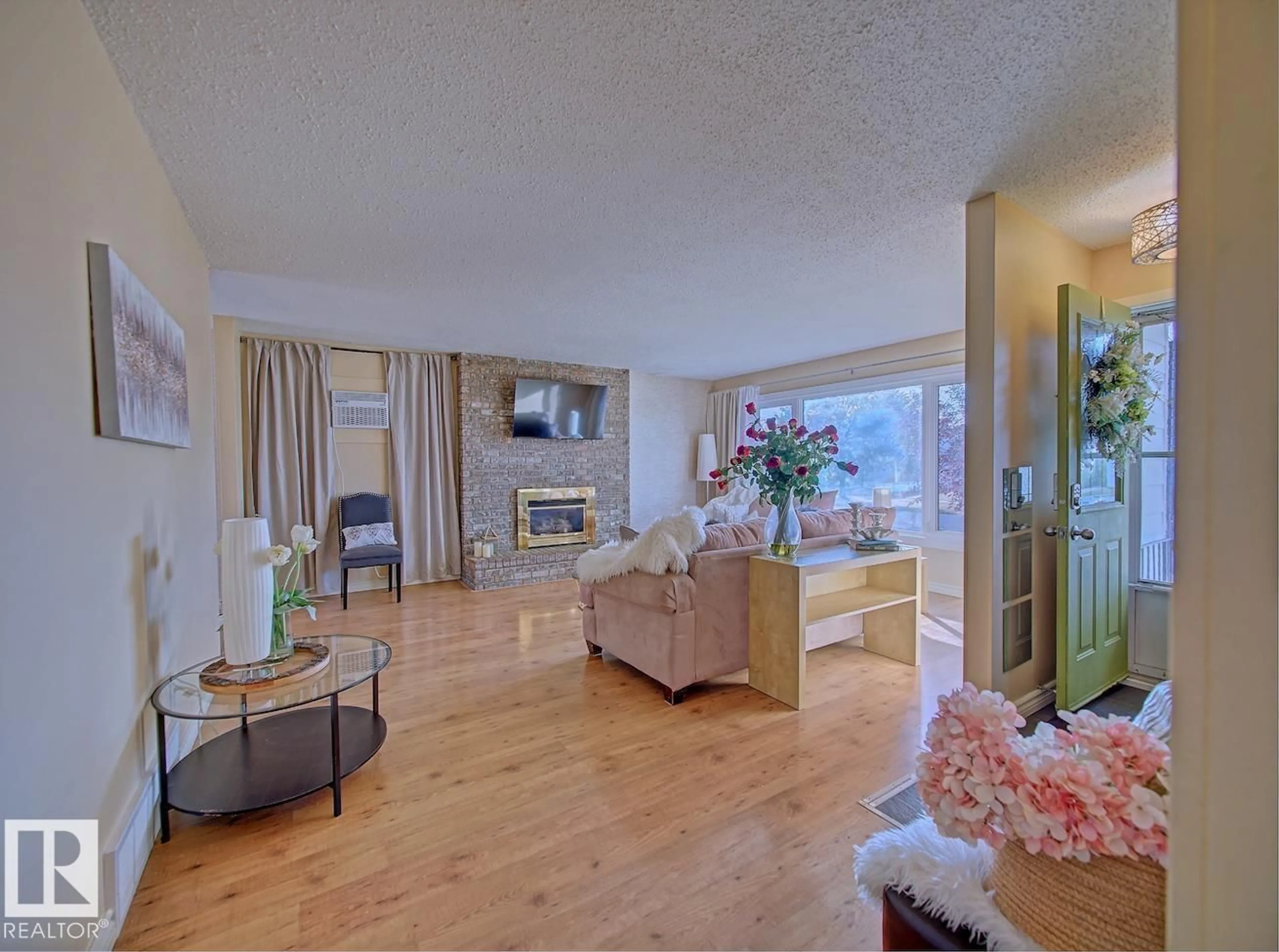 Living room with furniture, wood/laminate floor for 8268 94 AV, Fort Saskatchewan Alberta T8L2V2