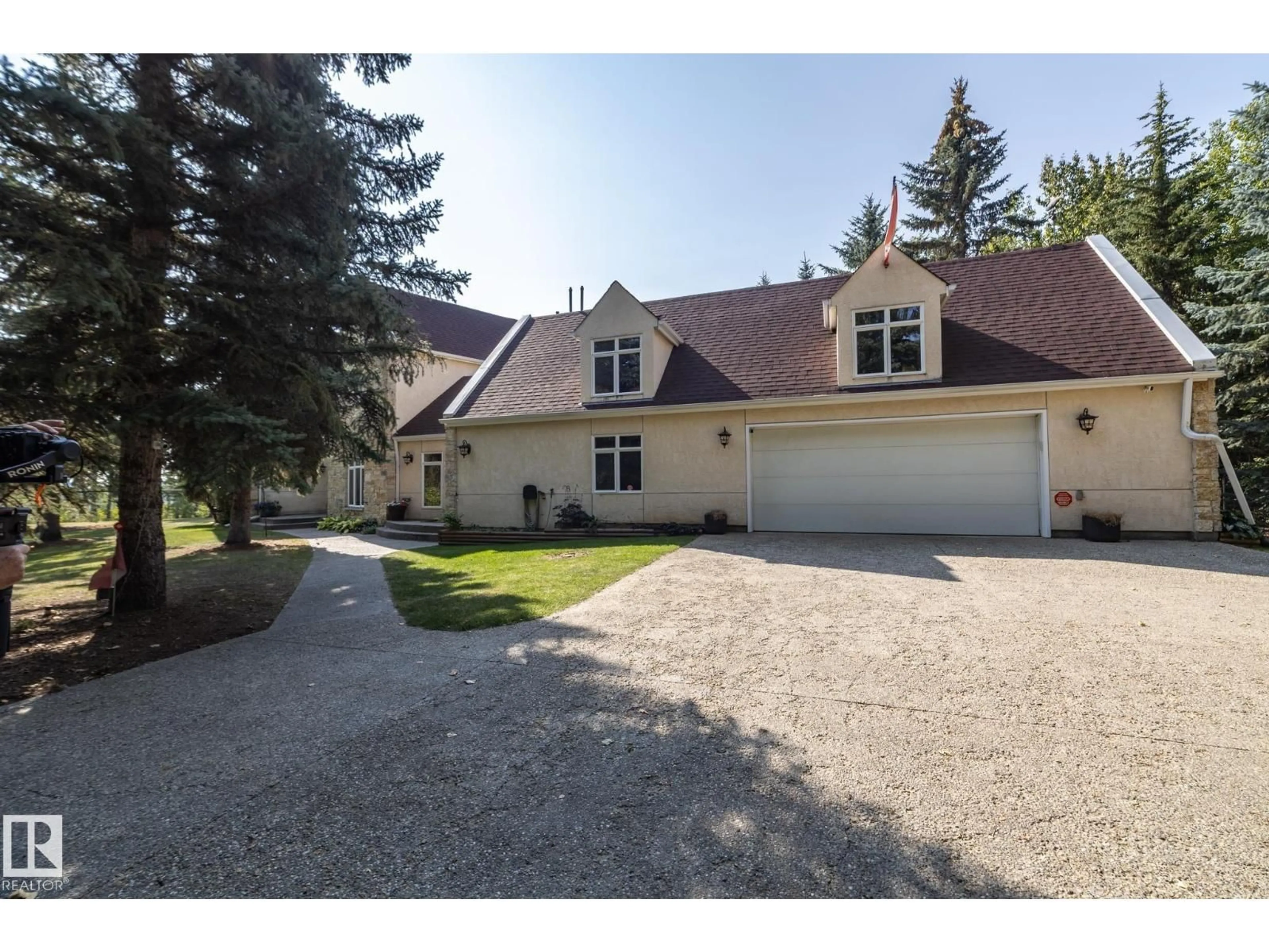 A pic from outside/outdoor area/front of a property/back of a property/a pic from drone, street for #12 - 27107 TWP ROAD 510, Rural Parkland County Alberta T7Y1H6