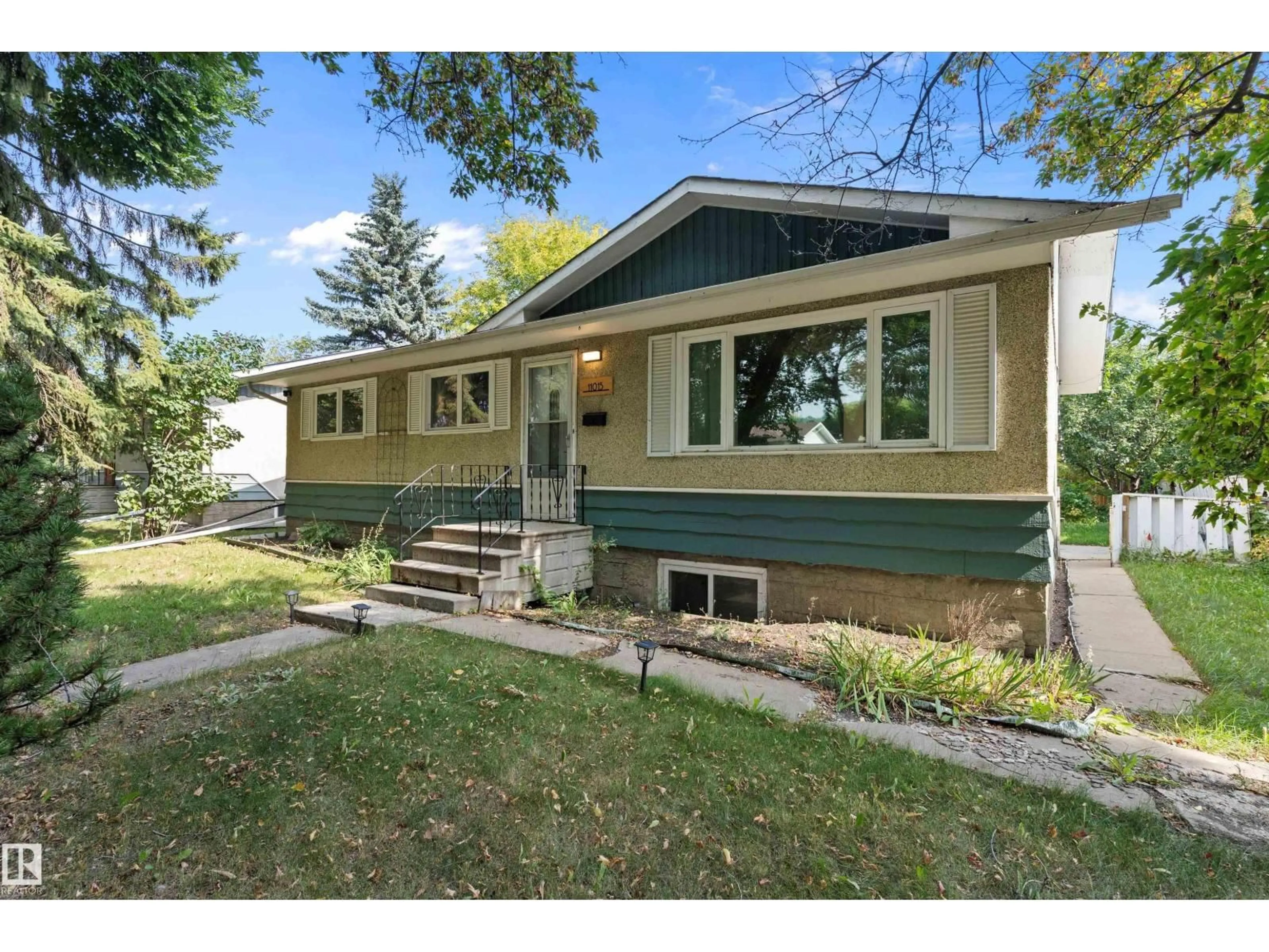 Home with vinyl exterior material, street for NW - 11015 152 ST, Edmonton Alberta T5P1Z9