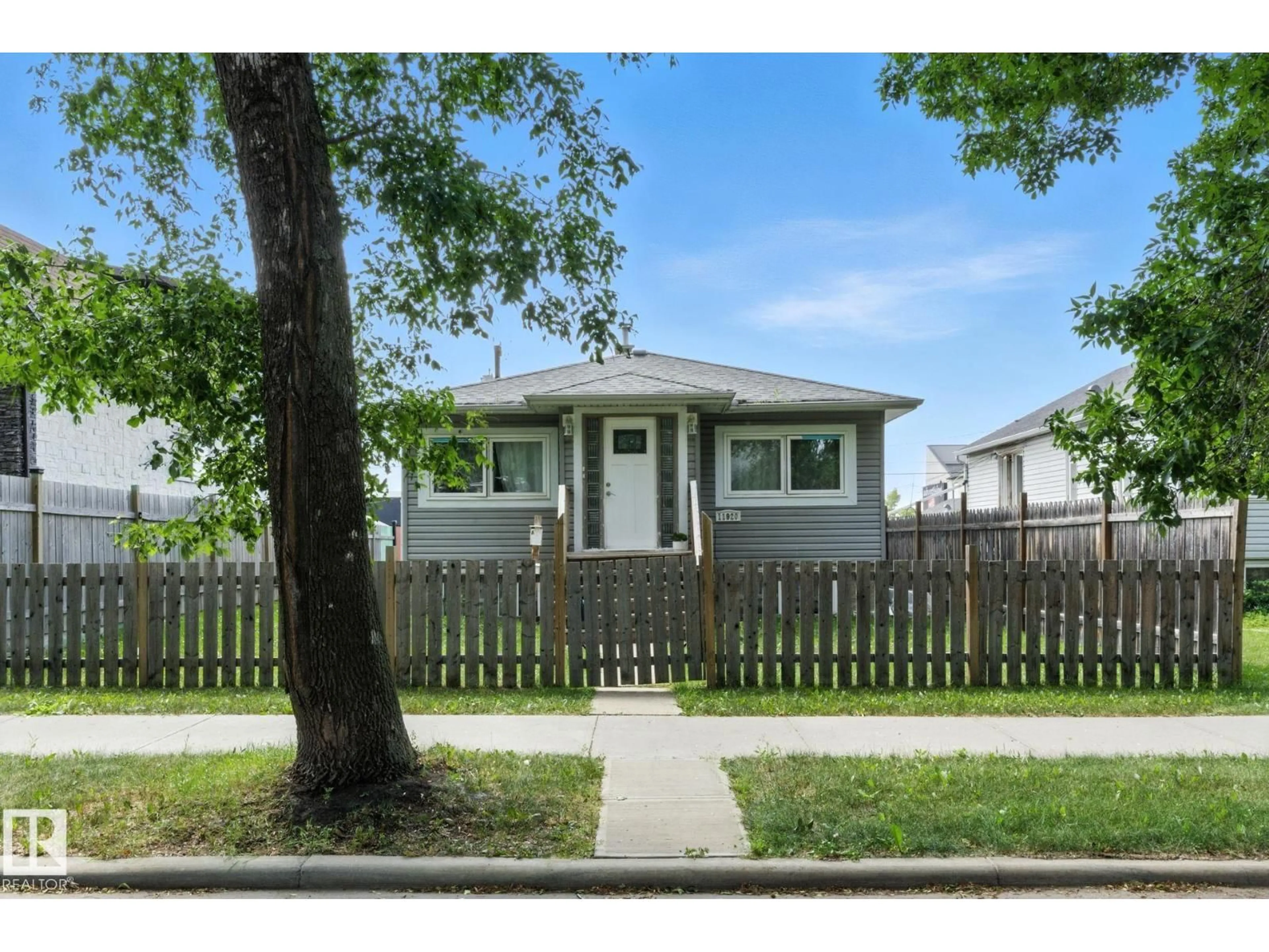 Home with vinyl exterior material, street for 11920 71 ST, Edmonton Alberta T5B1W7