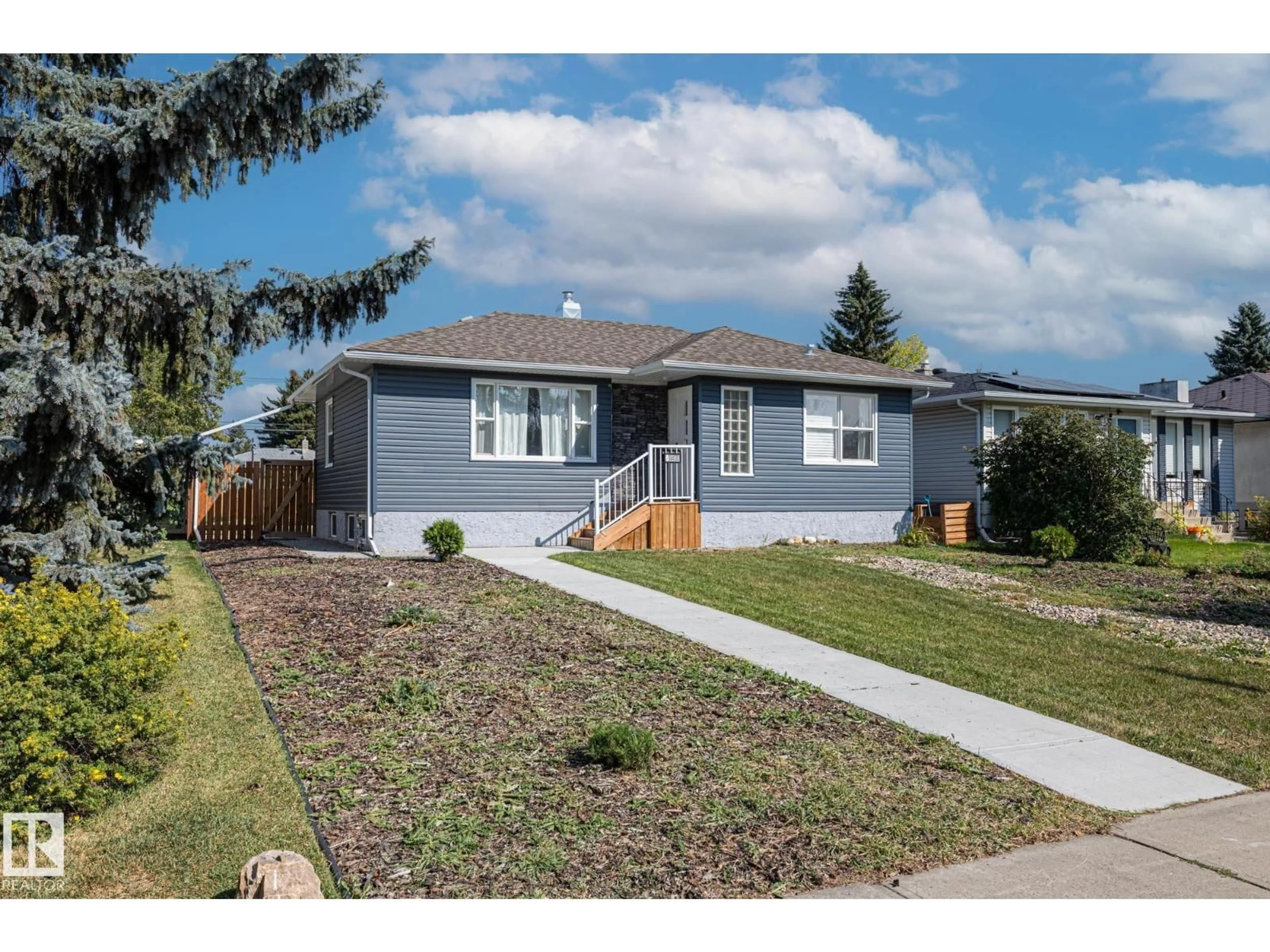 Home with vinyl exterior material, street for NW - 11420 112 AV, Edmonton Alberta T5G0H6