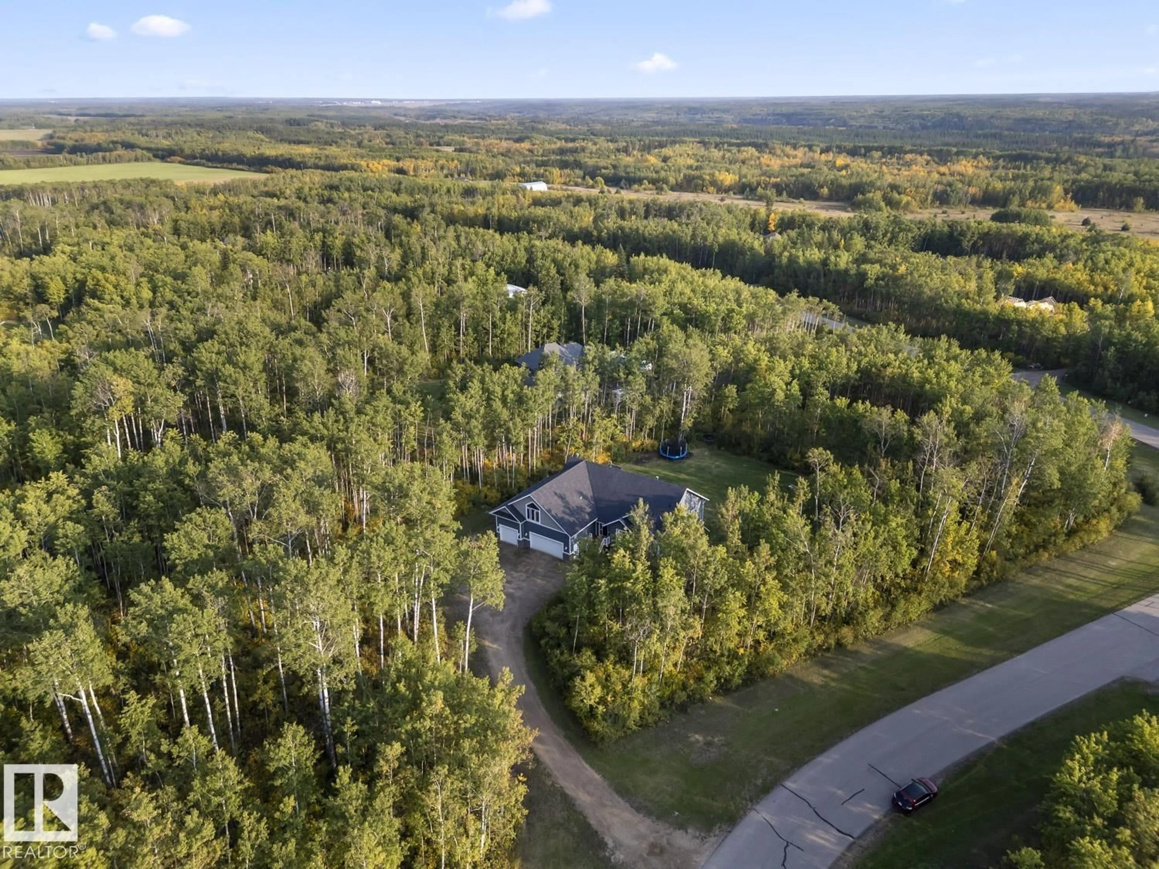 A pic from outside/outdoor area/front of a property/back of a property/a pic from drone, forest/trees view for 63220 - 16 RGE RD 433, Rural Bonnyville M.D. Alberta T9M1P1