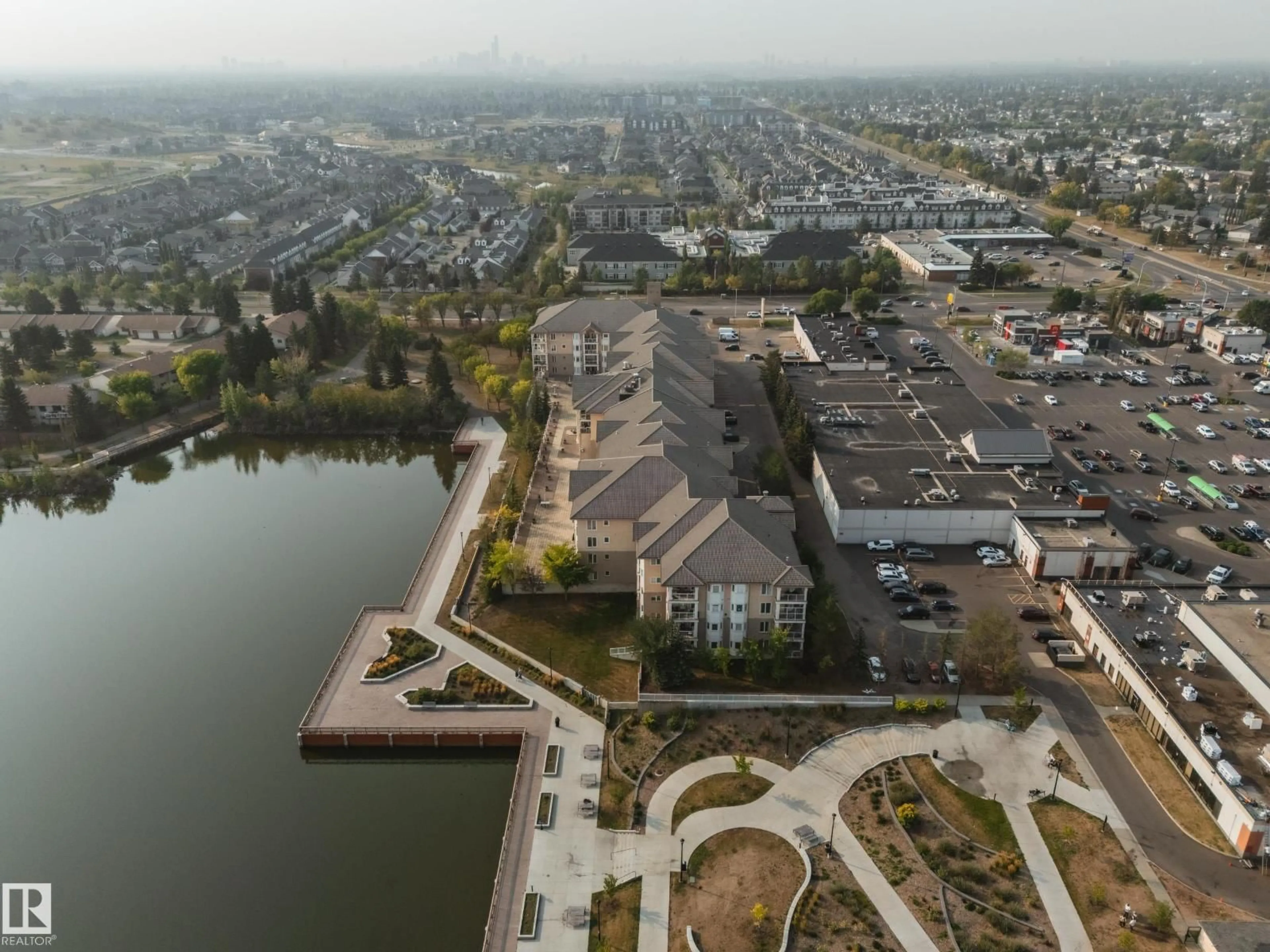 A pic from outside/outdoor area/front of a property/back of a property/a pic from drone, water/lake/river/ocean view for #301 - 11260 153 AV, Edmonton Alberta T5X6E7