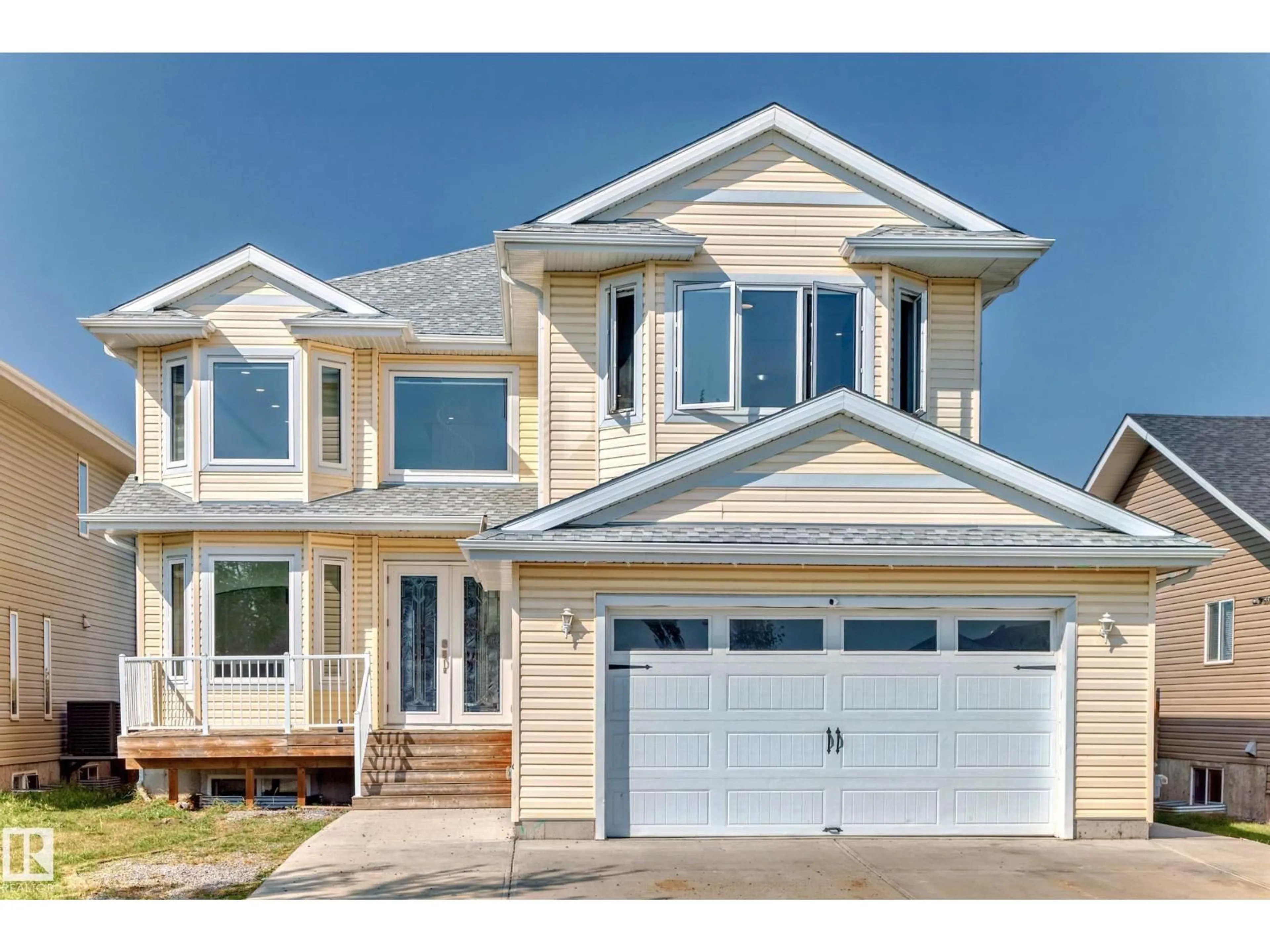 Home with vinyl exterior material, street for 128 HOULE DR, Morinville Alberta T8R0E1