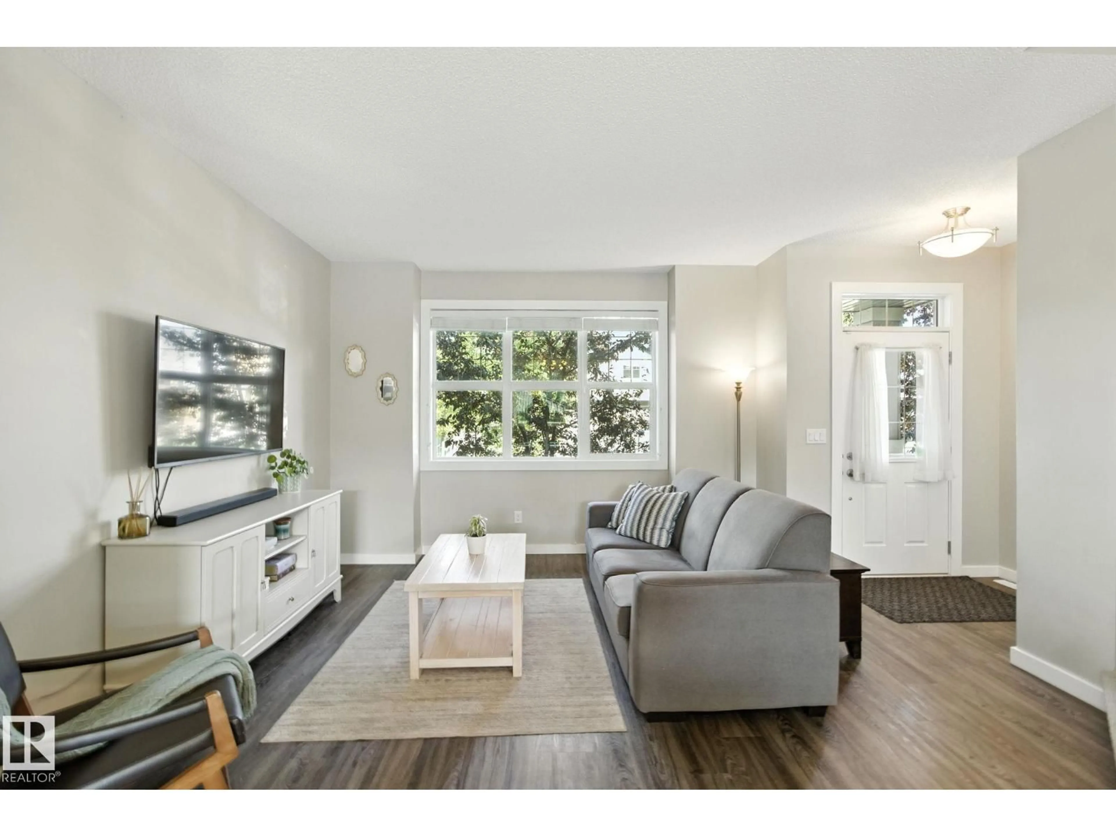 Living room with furniture, wood/laminate floor for 6088 ROSENTHAL WY, Edmonton Alberta T5T7C9