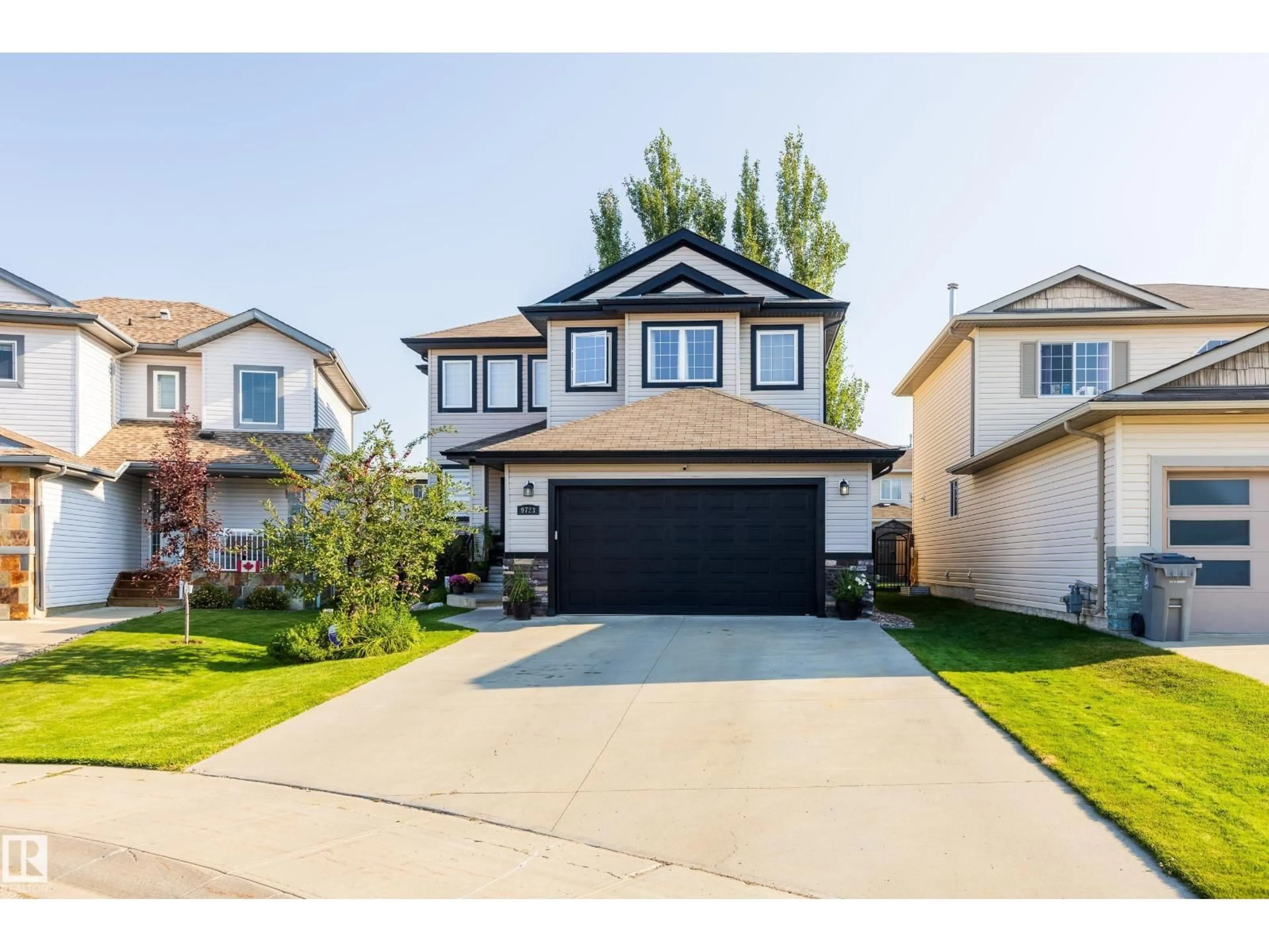Home with vinyl exterior material, street for 9723 88 ST, Morinville Alberta T8R1T8