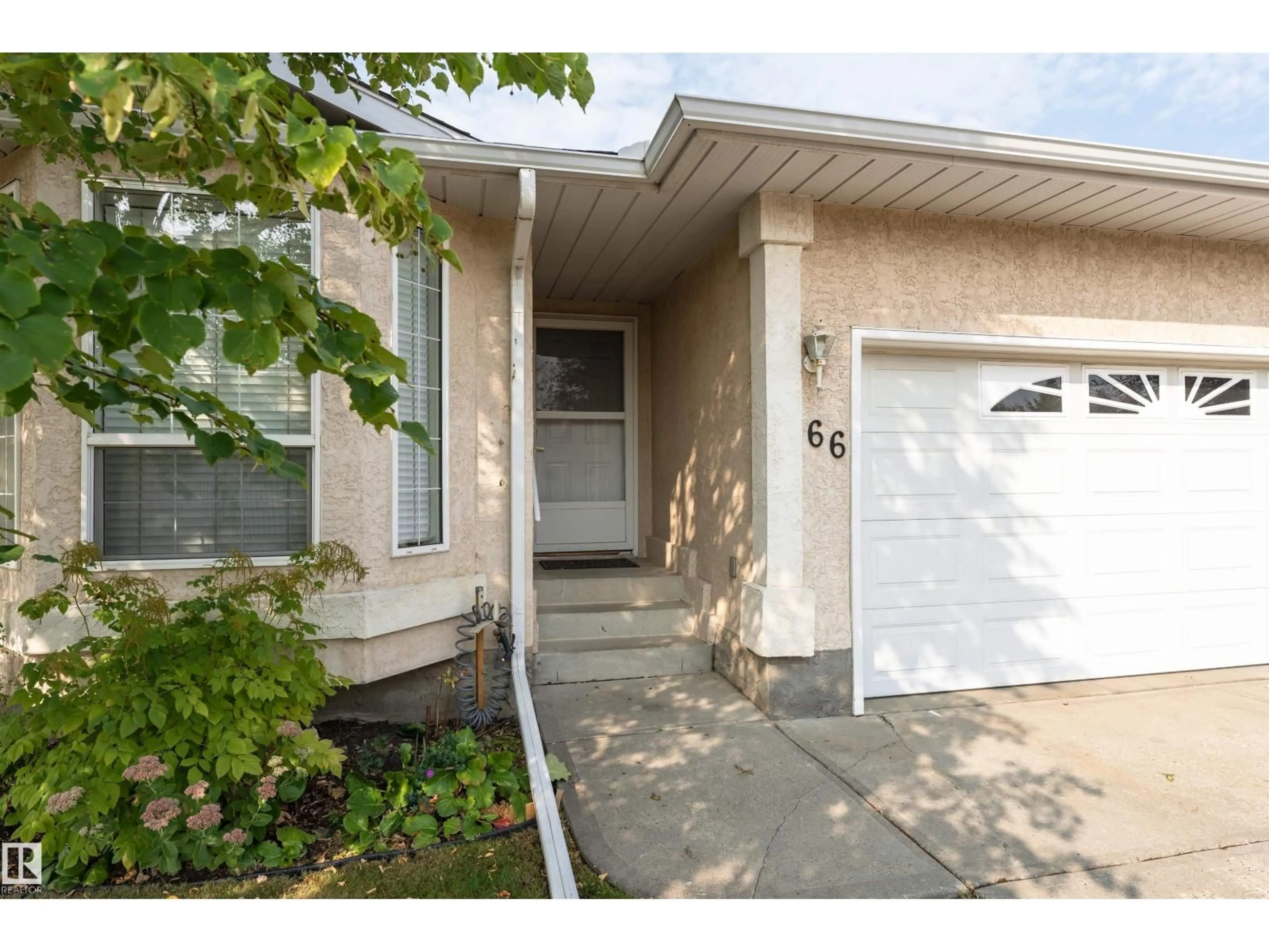 Home with vinyl exterior material, street for #66 - 13320 124 ST, Edmonton Alberta T5L5B7