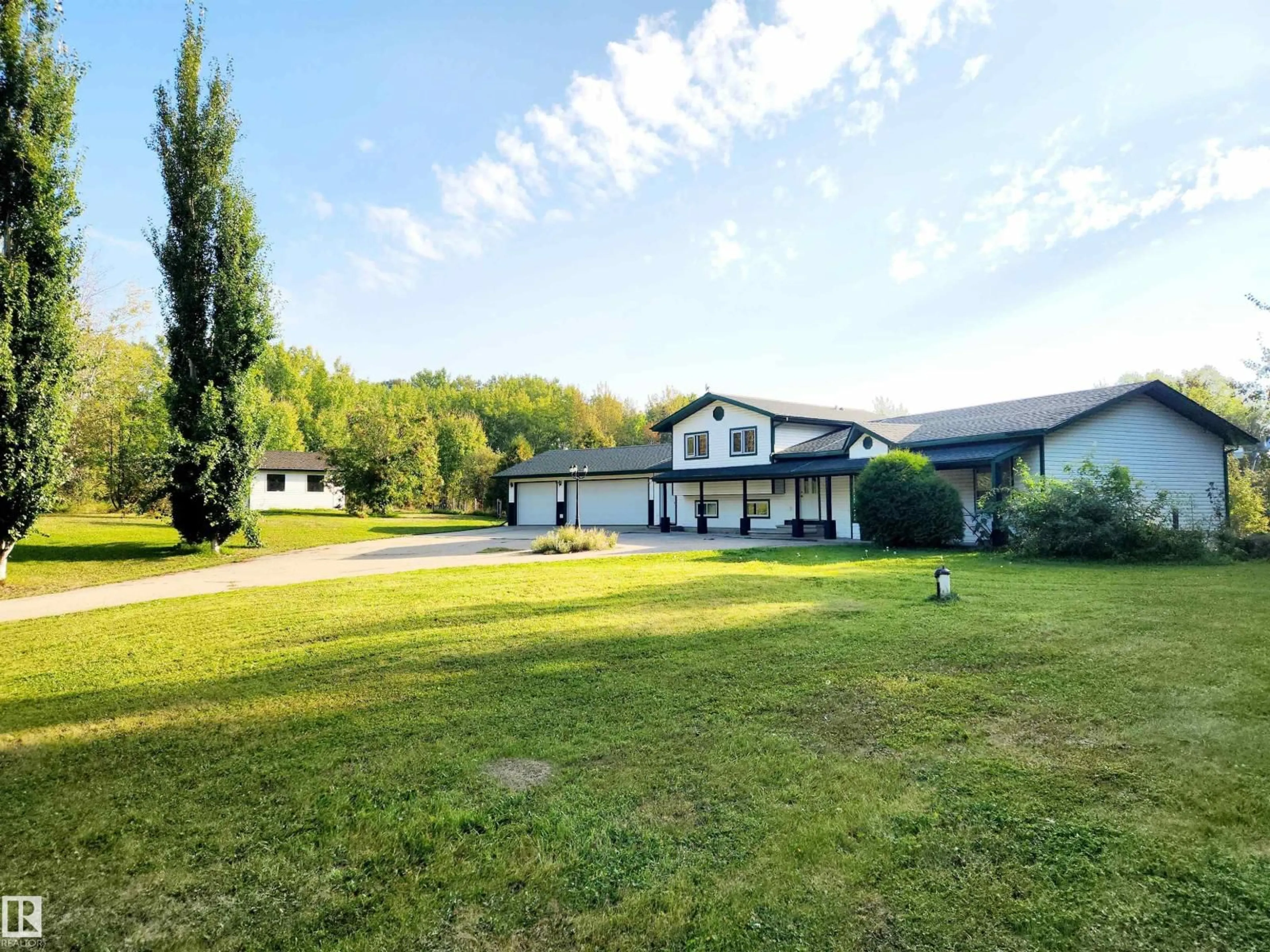 A pic from outside/outdoor area/front of a property/back of a property/a pic from drone, unknown for #101 - 52502 RGE ROAD 25, Rural Parkland County Alberta T7Y2M2