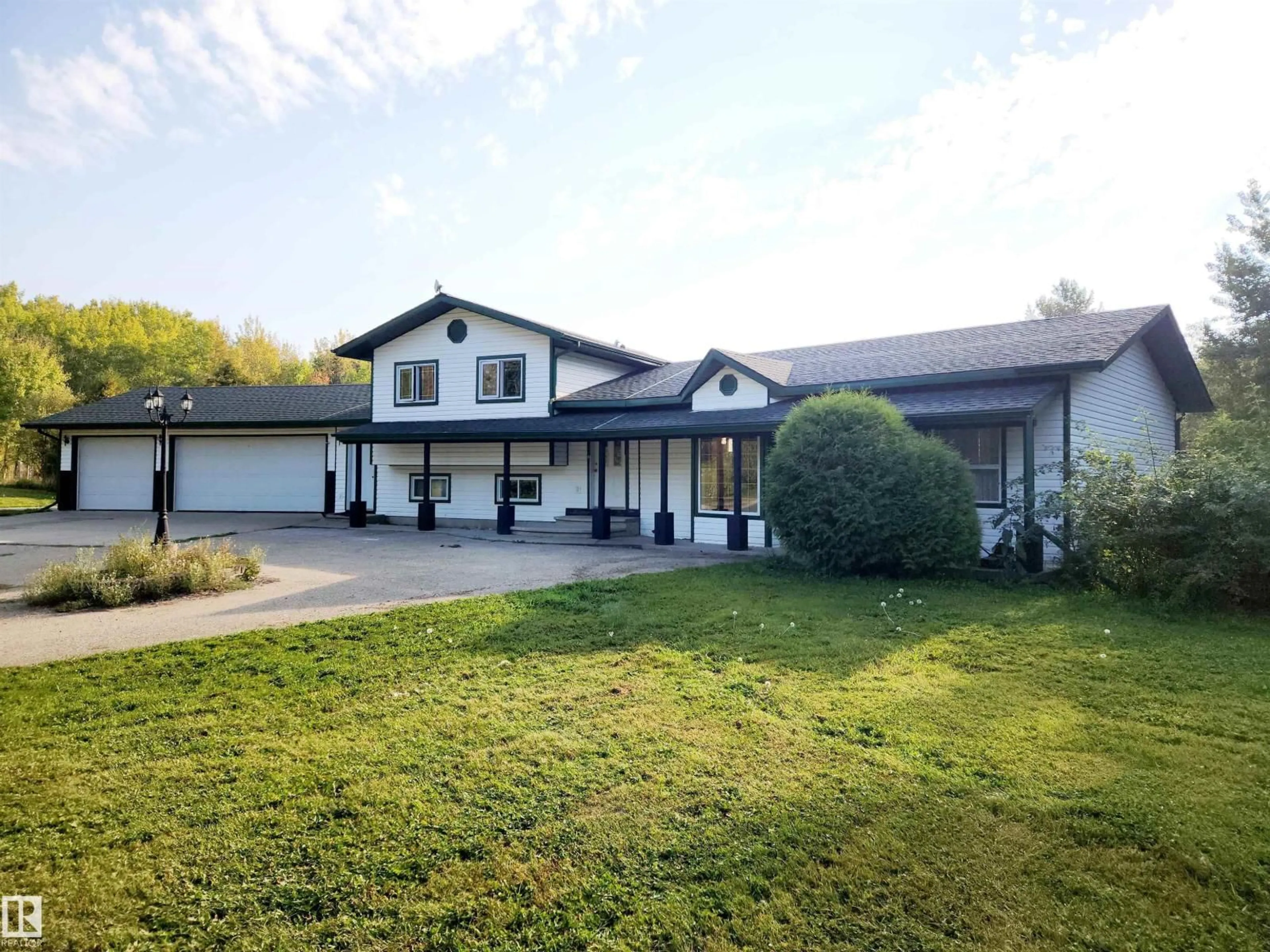 A pic from outside/outdoor area/front of a property/back of a property/a pic from drone, unknown for #101 - 52502 RGE ROAD 25, Rural Parkland County Alberta T7Y2M2