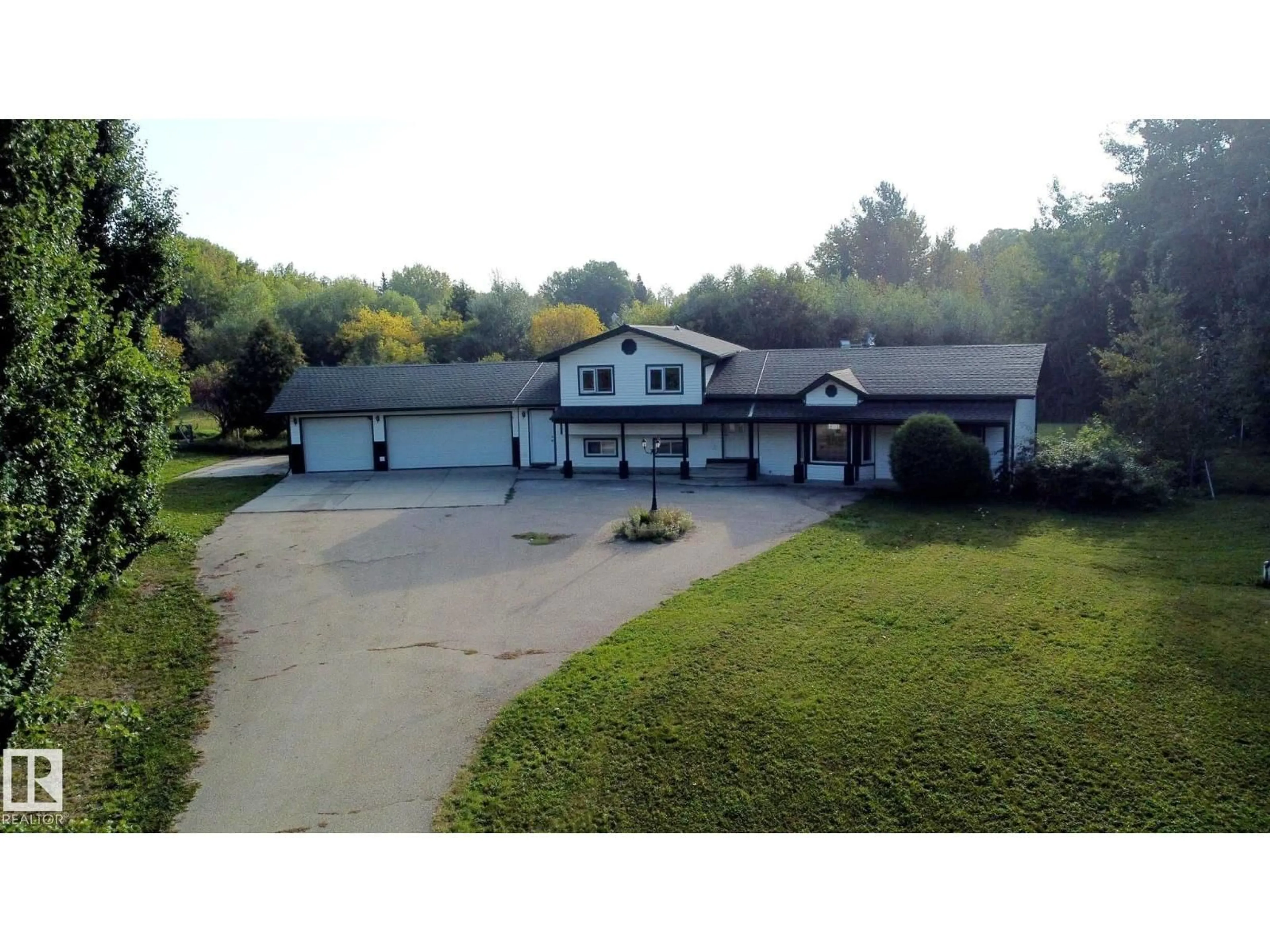 A pic from outside/outdoor area/front of a property/back of a property/a pic from drone, unknown for #101 - 52502 RGE ROAD 25, Rural Parkland County Alberta T7Y2M2