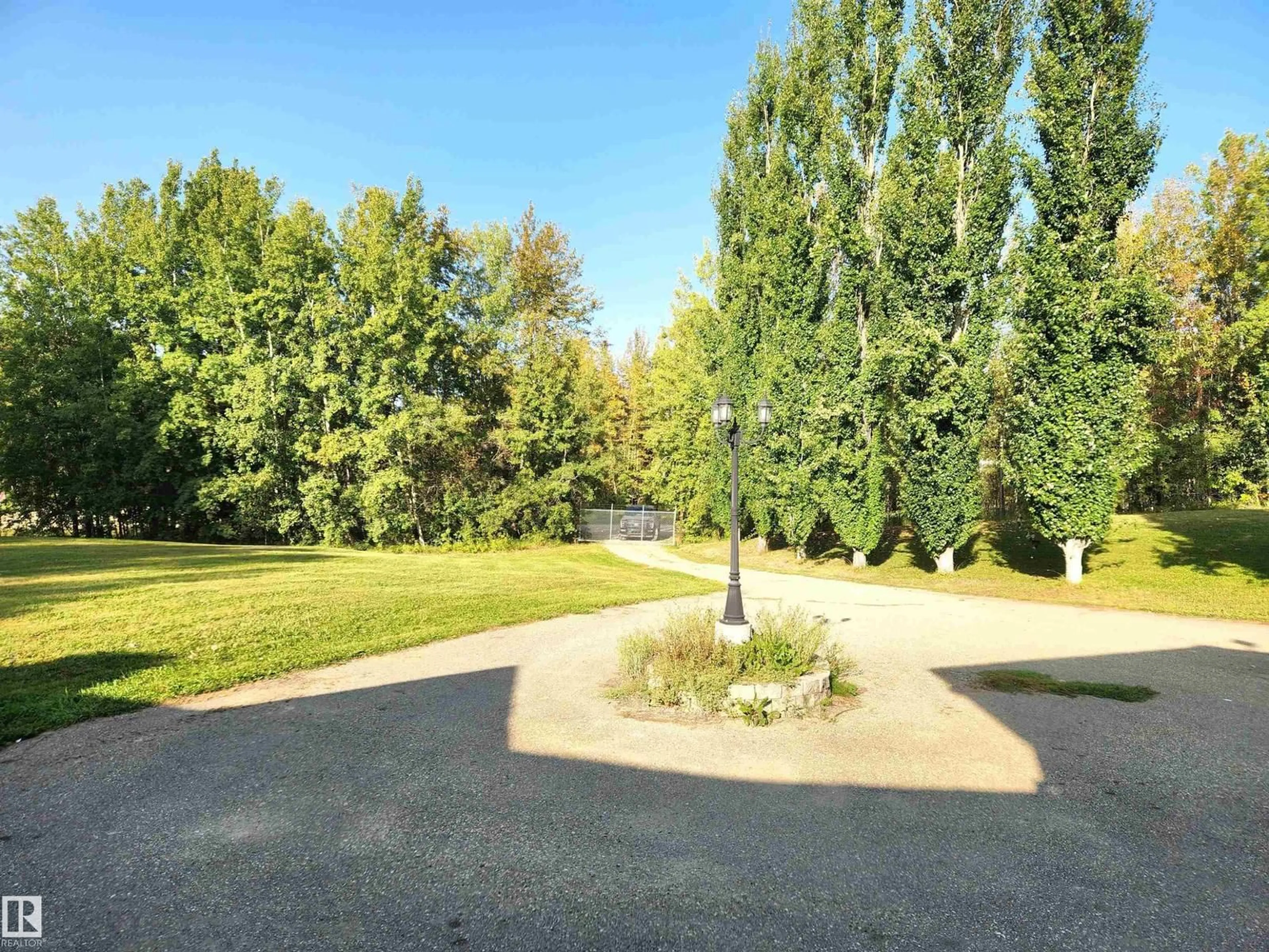 A pic from outside/outdoor area/front of a property/back of a property/a pic from drone, forest/trees view for #101 - 52502 RGE ROAD 25, Rural Parkland County Alberta T7Y2M2