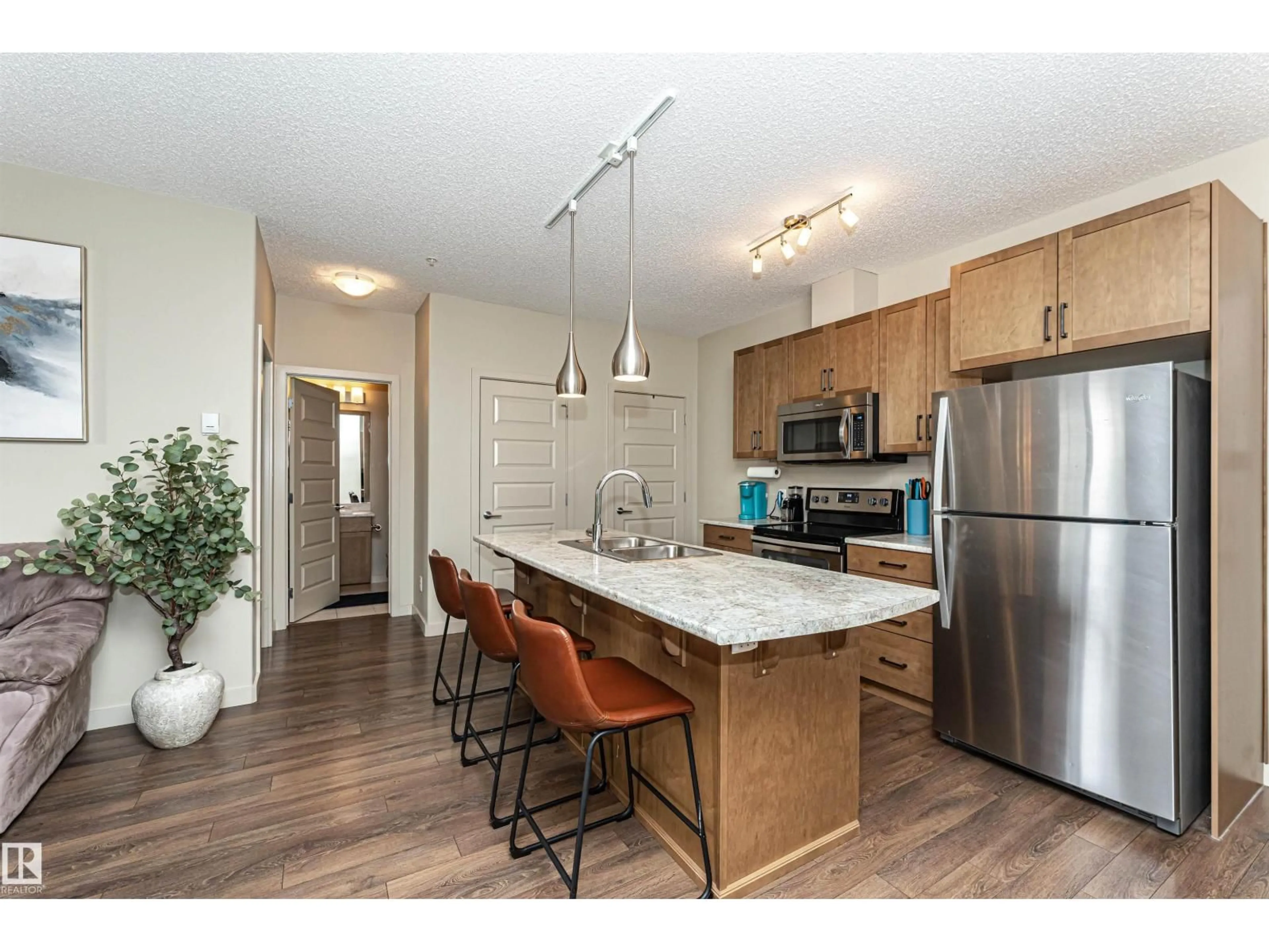 Open concept kitchen, wood/laminate floor for 503 - 225 ALBANY WAY, Edmonton Alberta T6V0M5