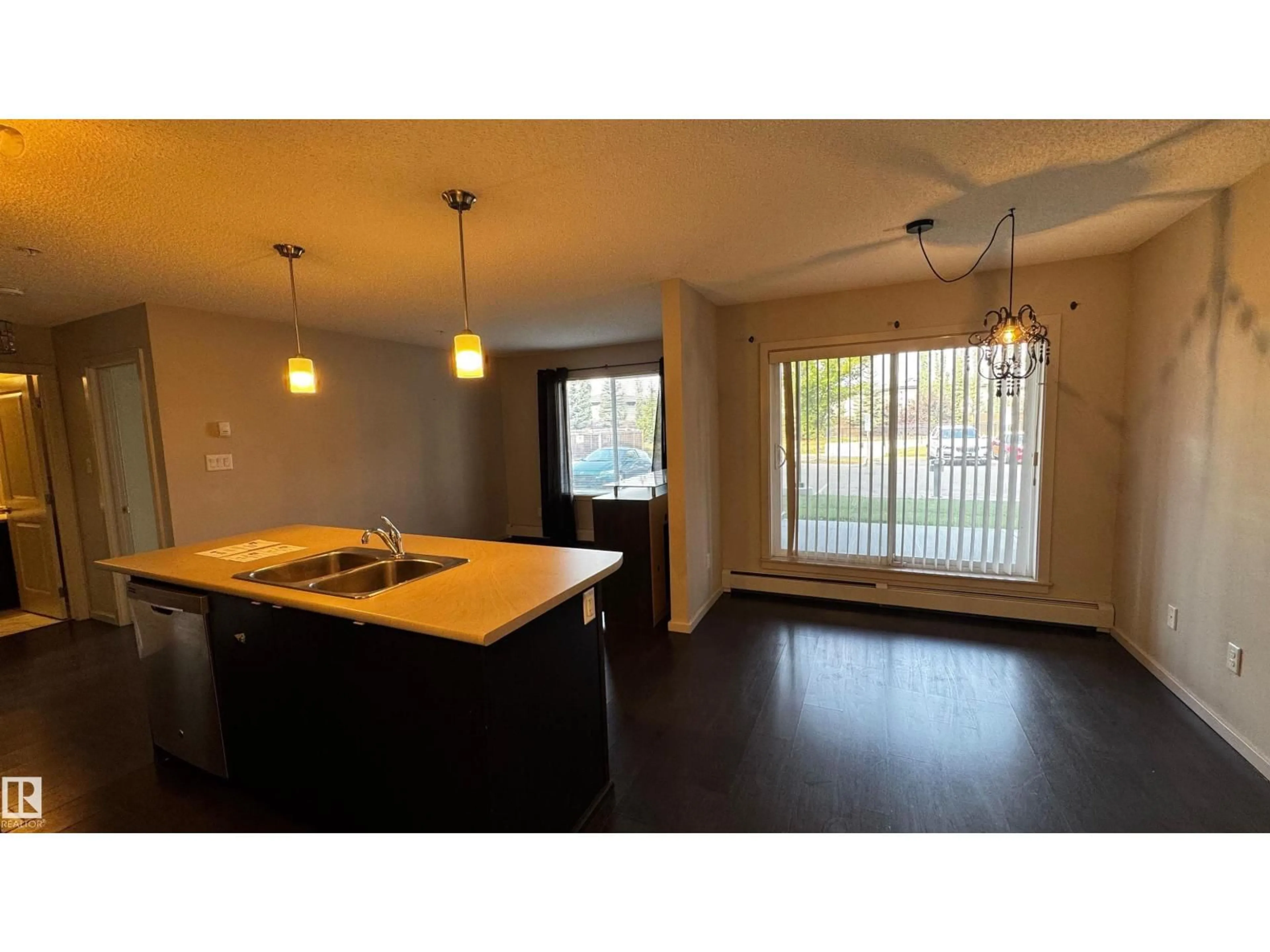 Open concept kitchen, wood/laminate floor for 344 - 132 WINDERMERE RD, Edmonton Alberta T6W2P2