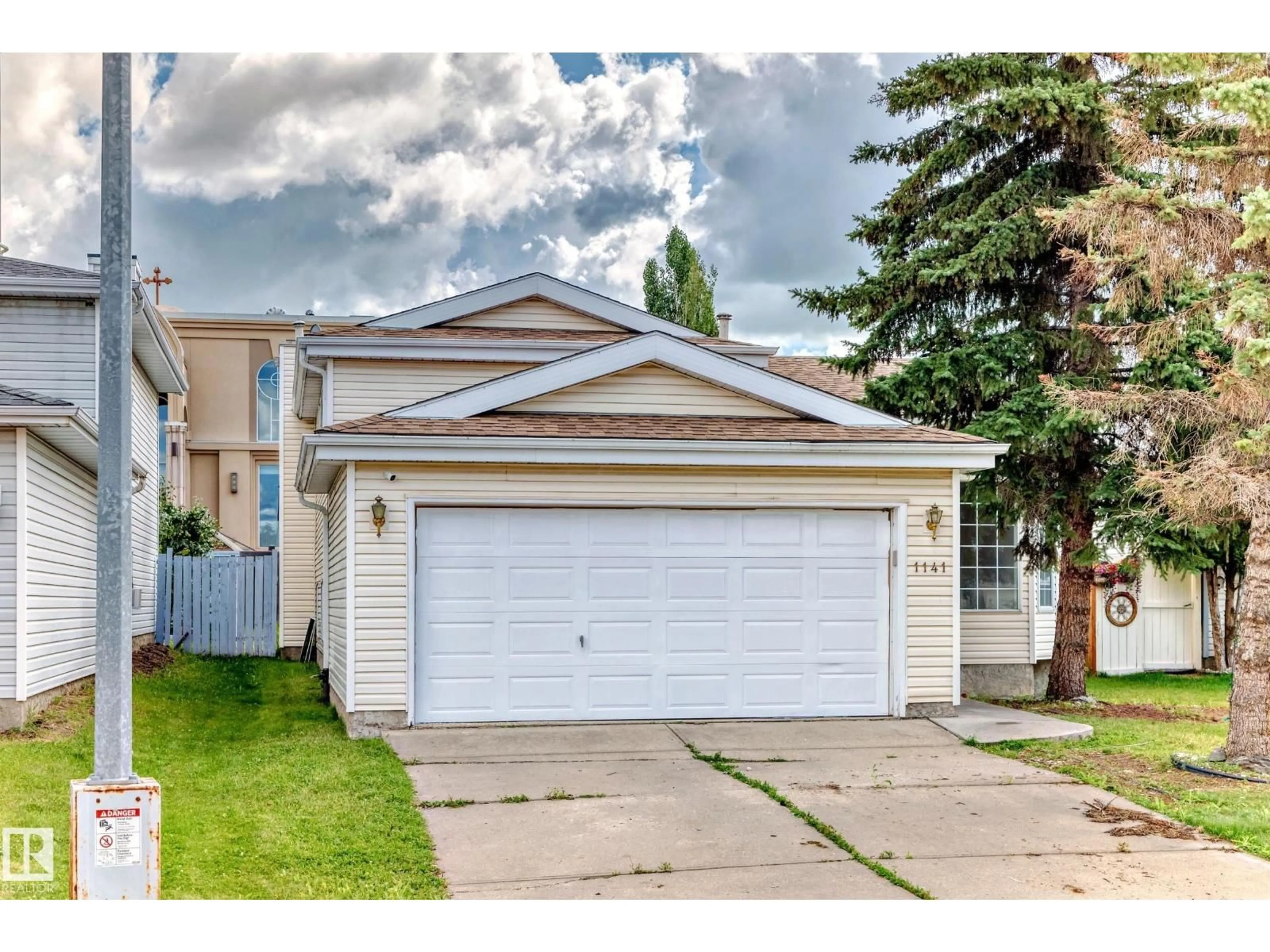 Home with vinyl exterior material, street for 1141 60 ST, Edmonton Alberta T6L6R4