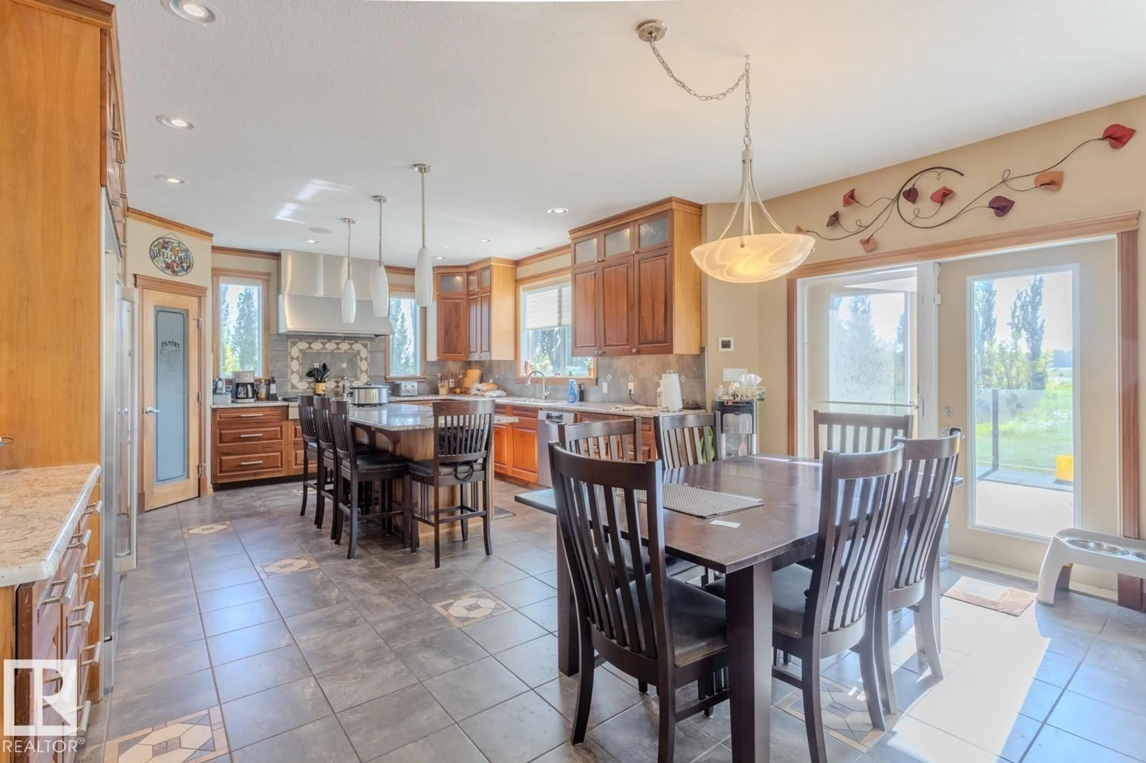 Open concept kitchen, ceramic/tile floor for 27510 HWY 37, Rural Sturgeon County Alberta T8R0J2