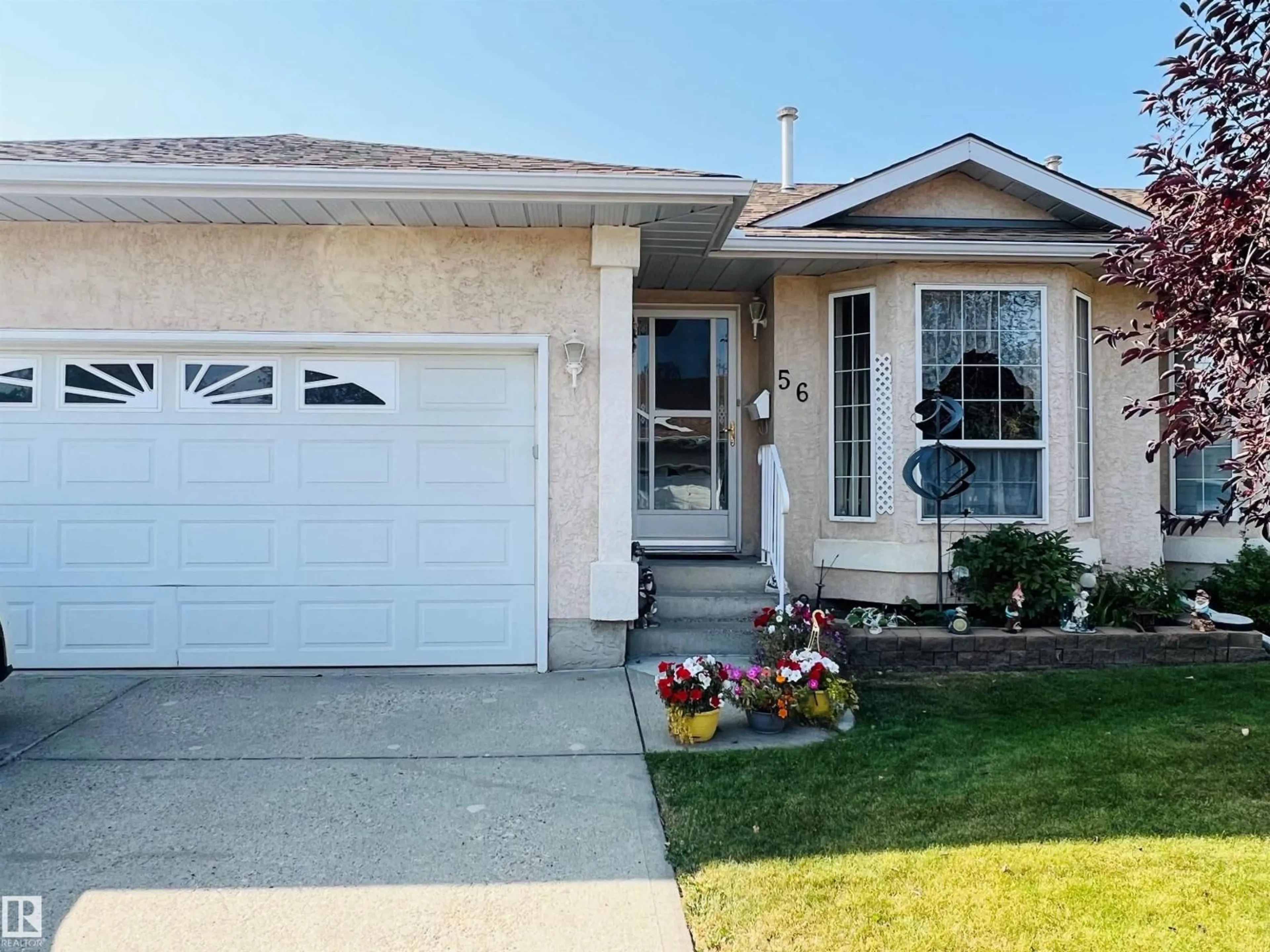 Home with vinyl exterior material, street for 13320 - 56 124 ST, Edmonton Alberta T5L5B7
