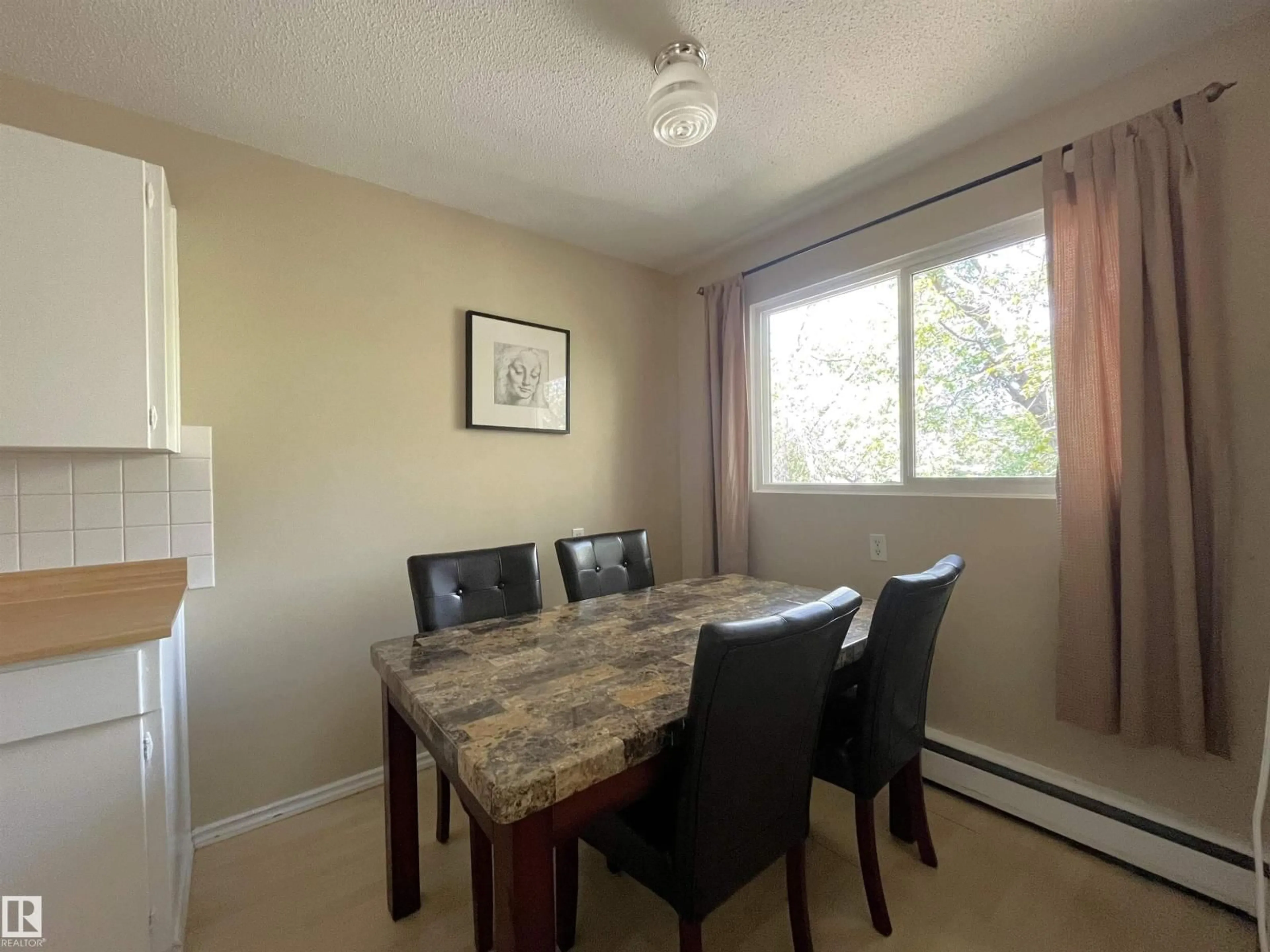 Dining room, wood/laminate floor for 23 - 5631 105 ST NW, Edmonton Alberta T6H2N2
