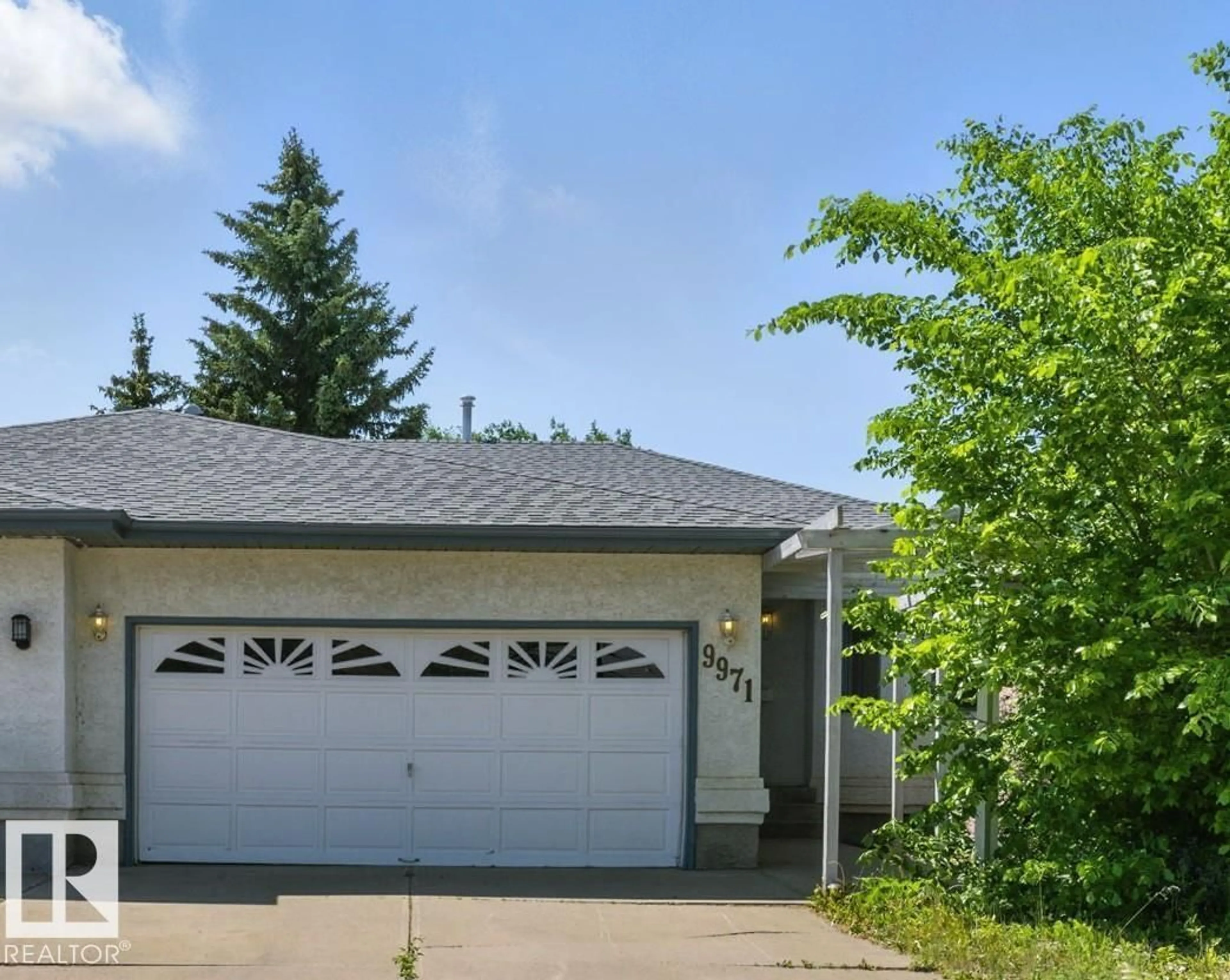 Home with vinyl exterior material, street for 9971 178 AV, Edmonton Alberta T5X5X2