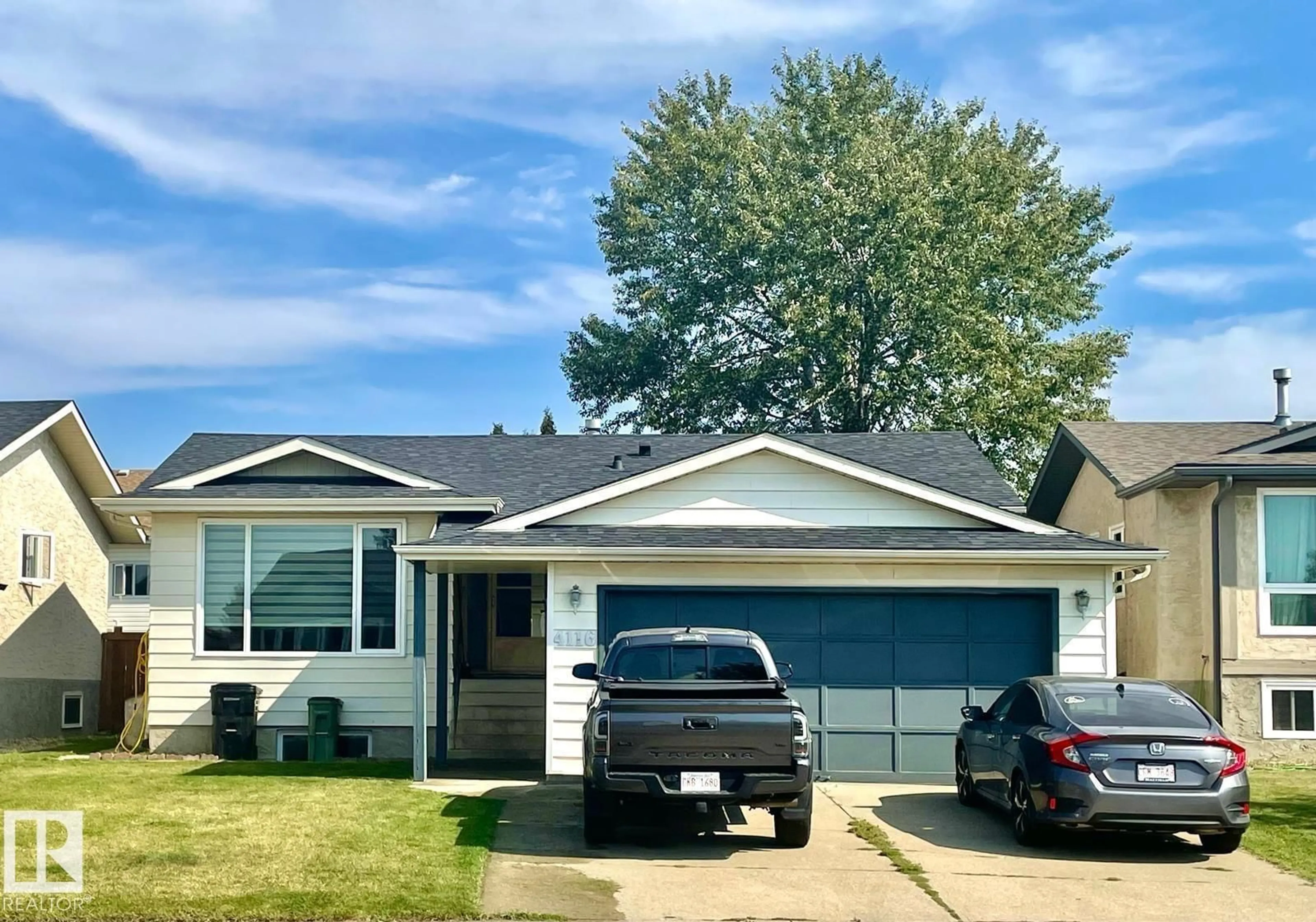 Home with vinyl exterior material, street for NW - 4116 27 AV, Edmonton Alberta T6L4G9