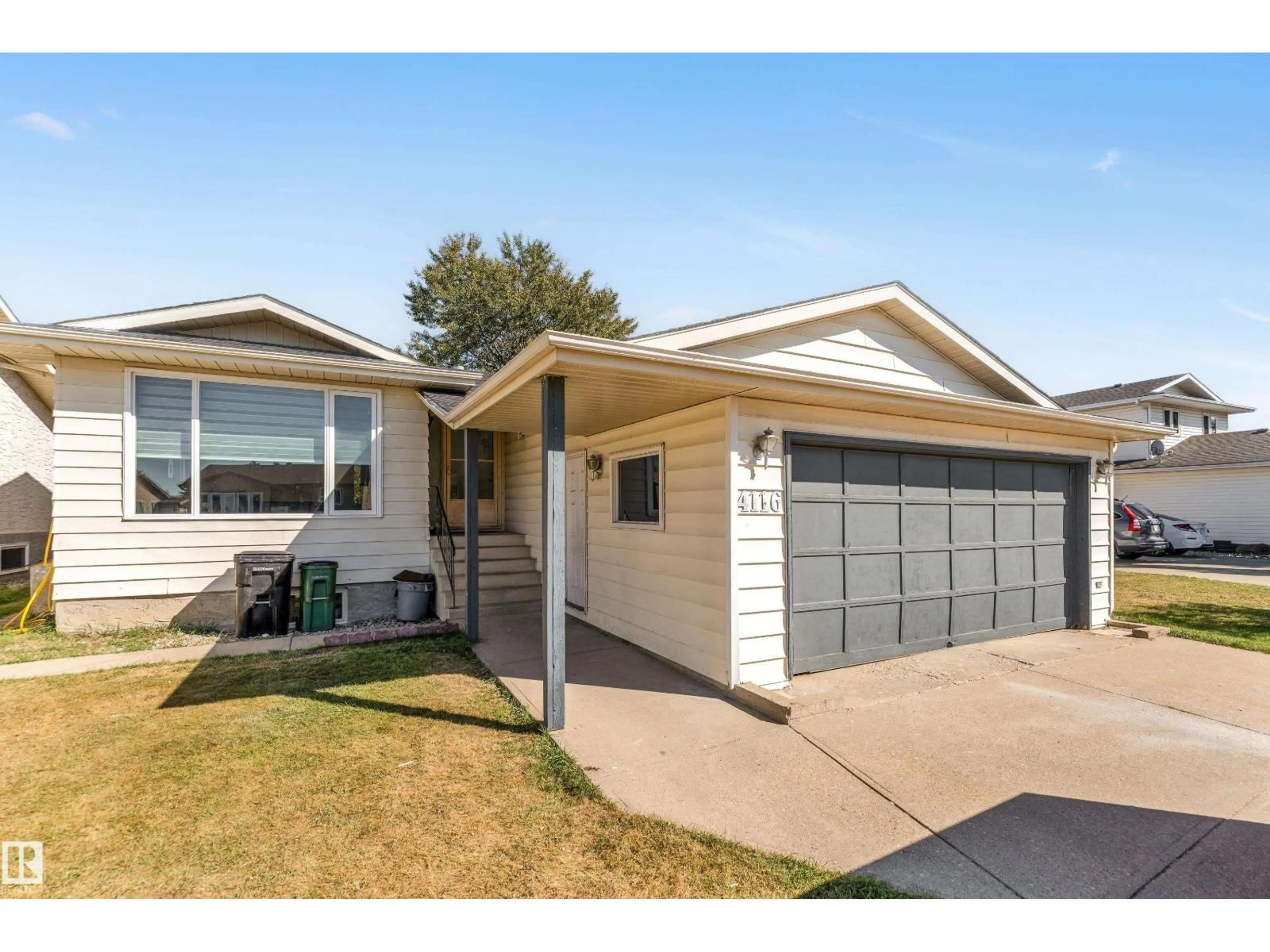 Home with vinyl exterior material, street for NW - 4116 27 AV, Edmonton Alberta T6L4G9