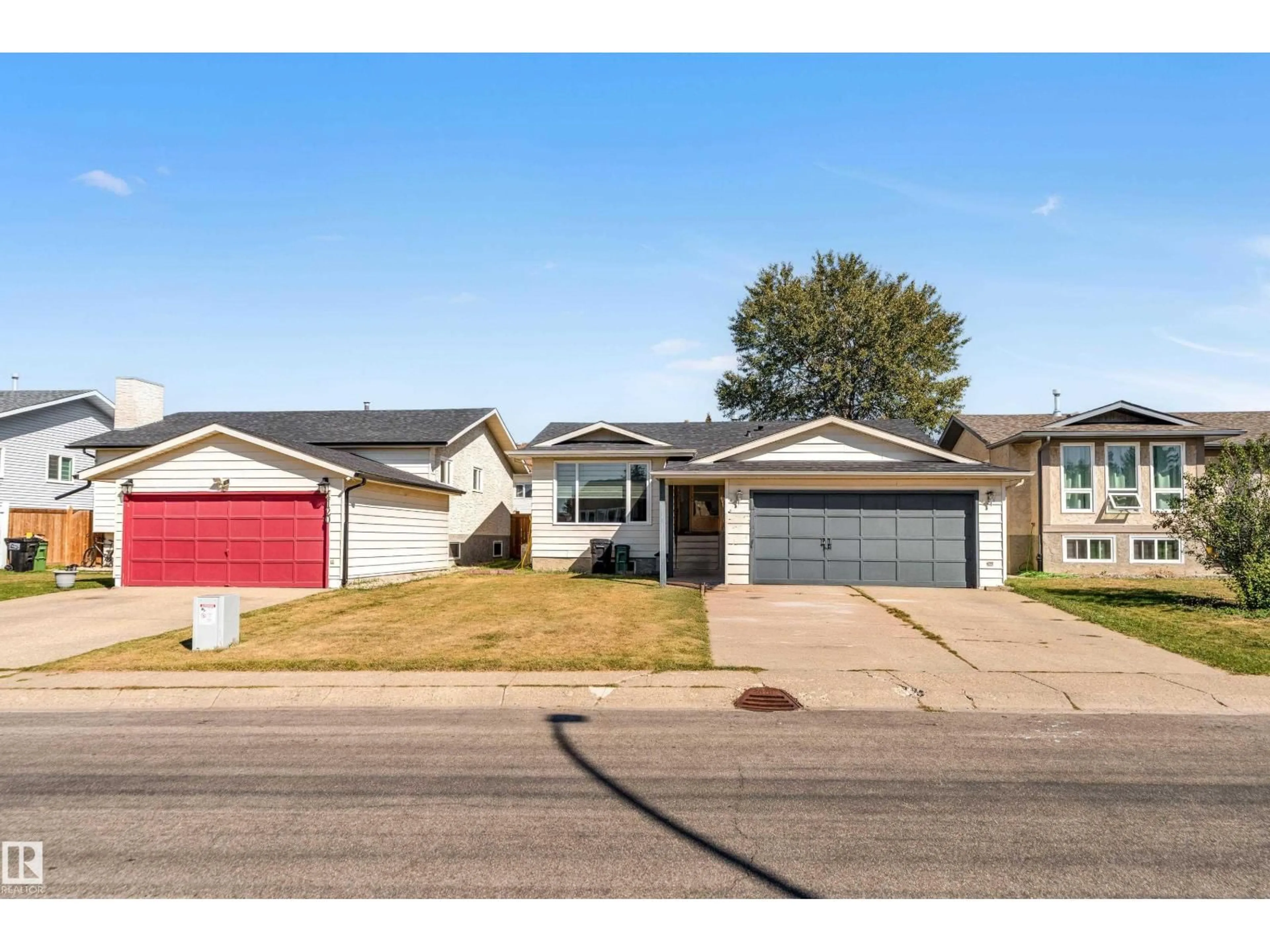 Home with vinyl exterior material, street for NW - 4116 27 AV, Edmonton Alberta T6L4G9