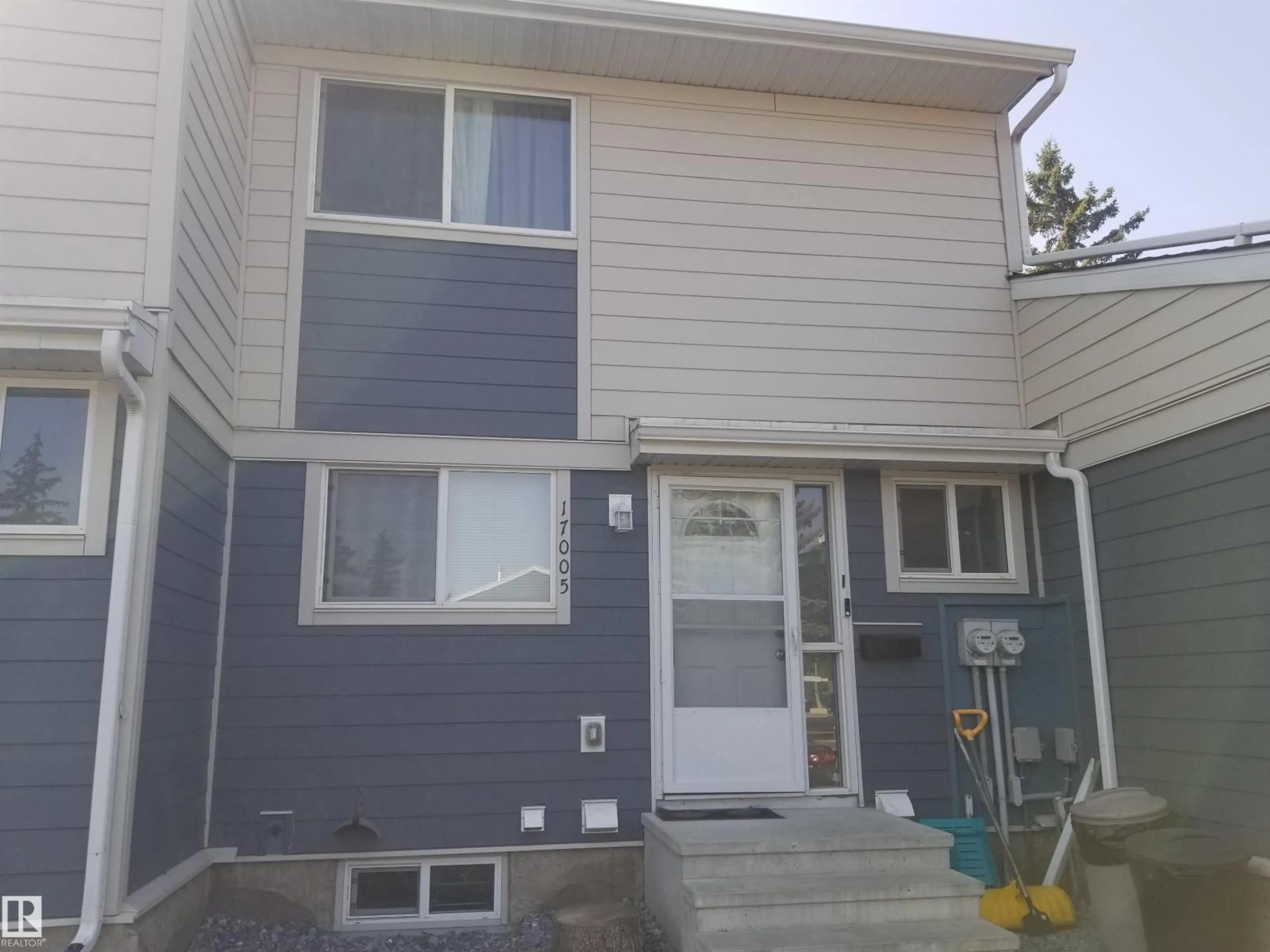 Home with vinyl exterior material, street for 17005 100 ST, Edmonton Alberta T5X4R8