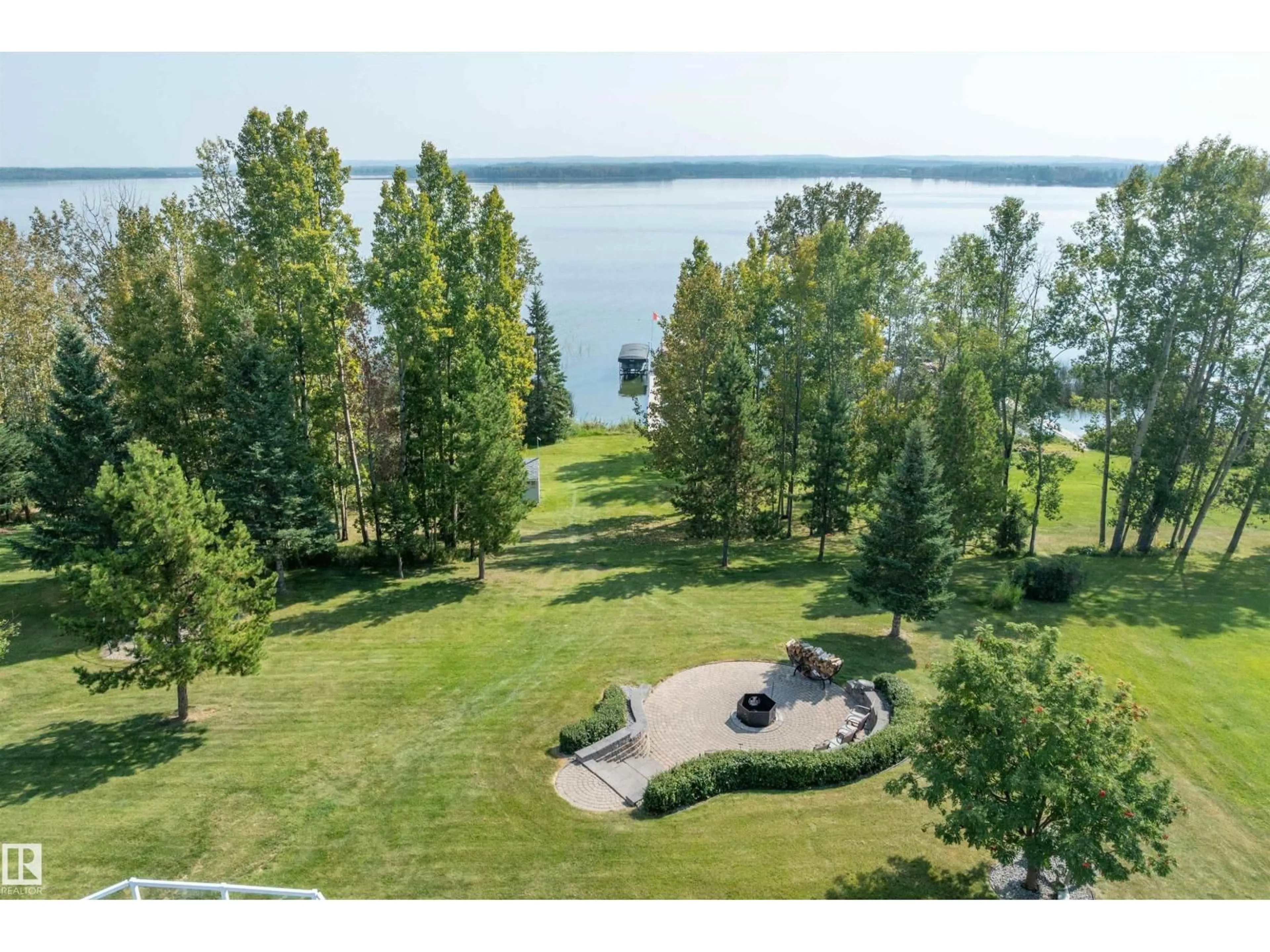 A pic from outside/outdoor area/front of a property/back of a property/a pic from drone, water/lake/river/ocean view for 9 - 62001 TWP ROAD 462 A, Rural Wetaskiwin County Alberta T0C2X0
