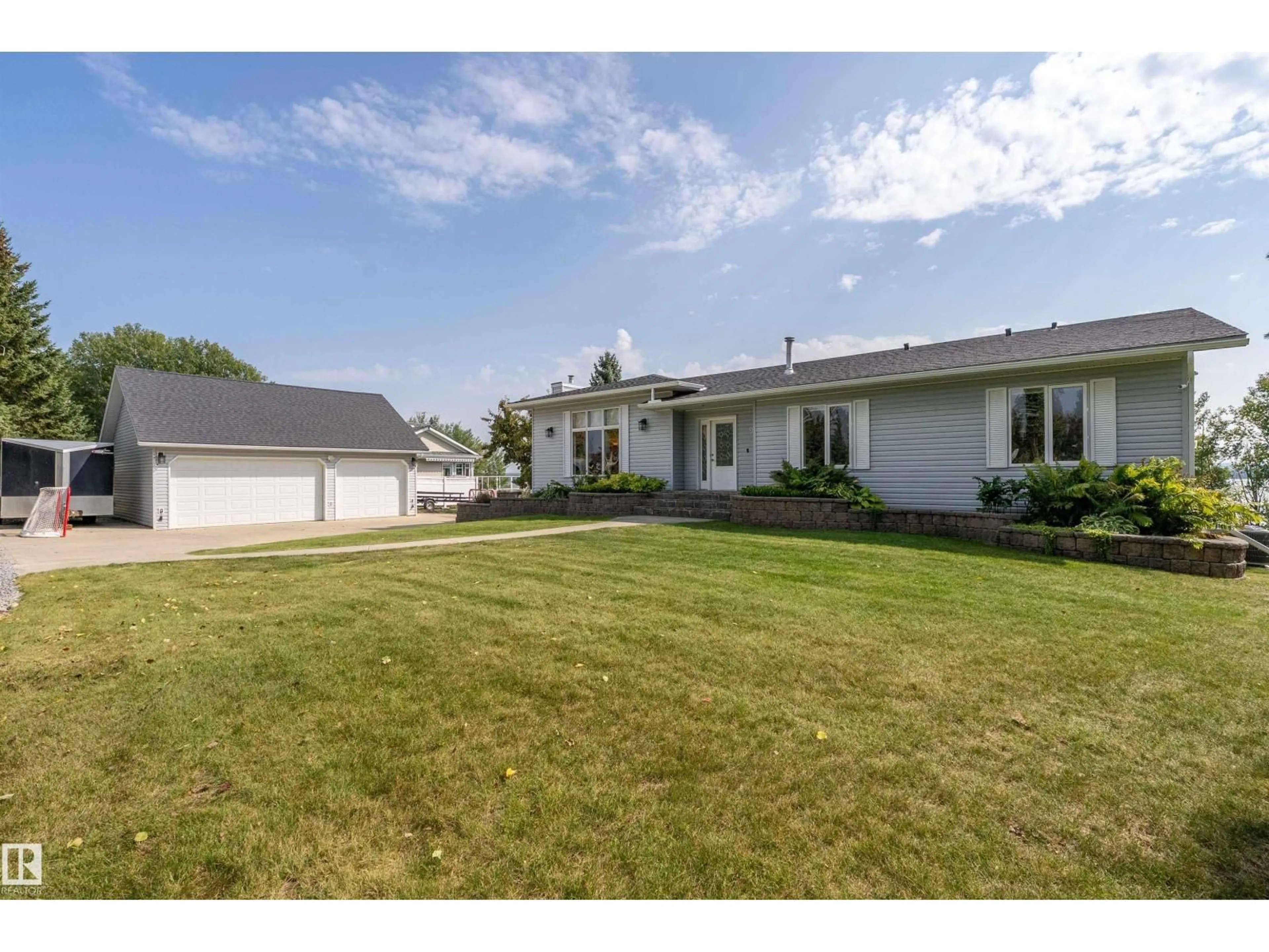 A pic from outside/outdoor area/front of a property/back of a property/a pic from drone, street for 9 - 62001 TWP ROAD 462 A, Rural Wetaskiwin County Alberta T0C2X0
