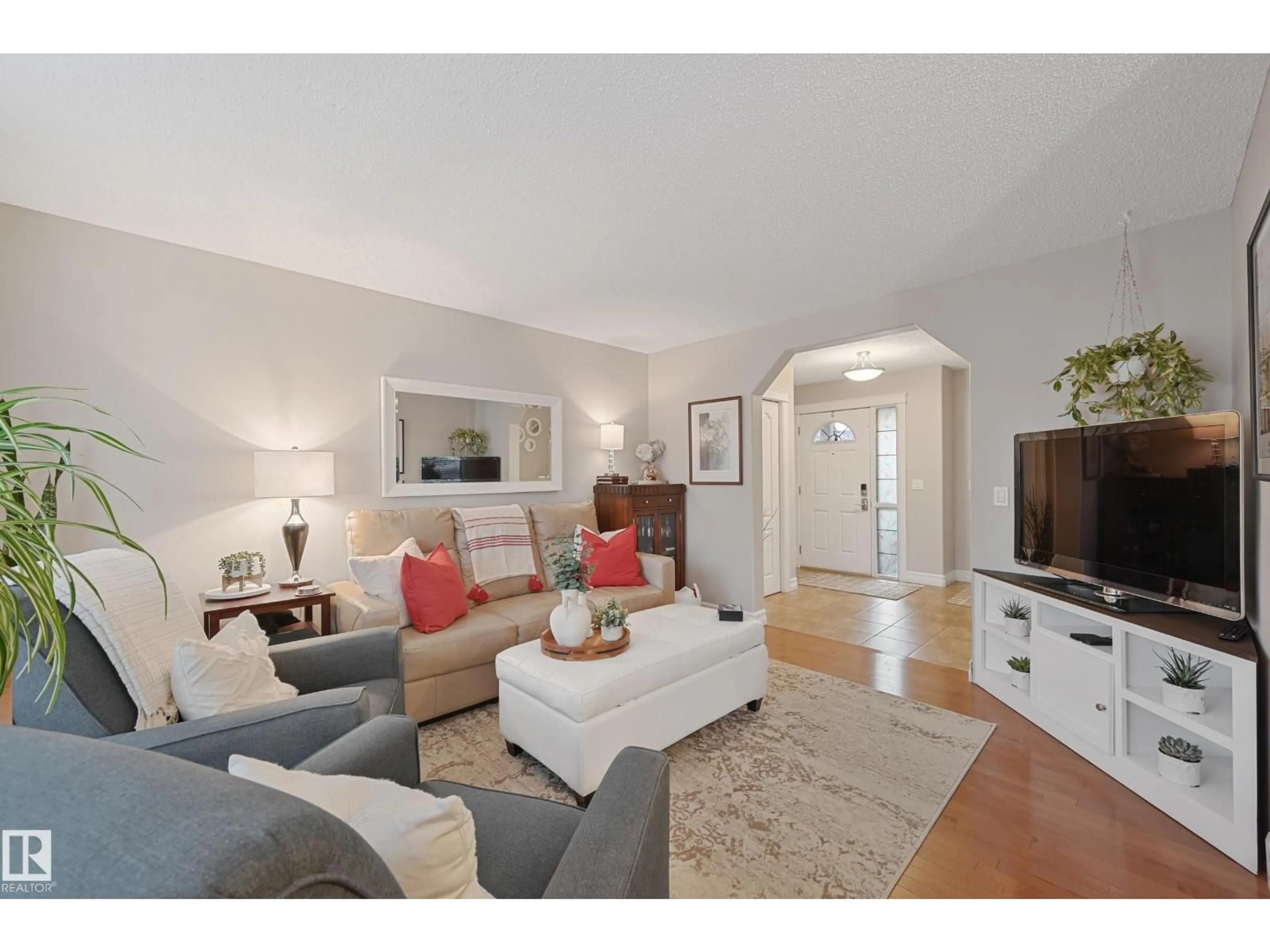 Living room with furniture, wood/laminate floor for 7 SPRING GROVE CR, Spruce Grove Alberta T7X0E7