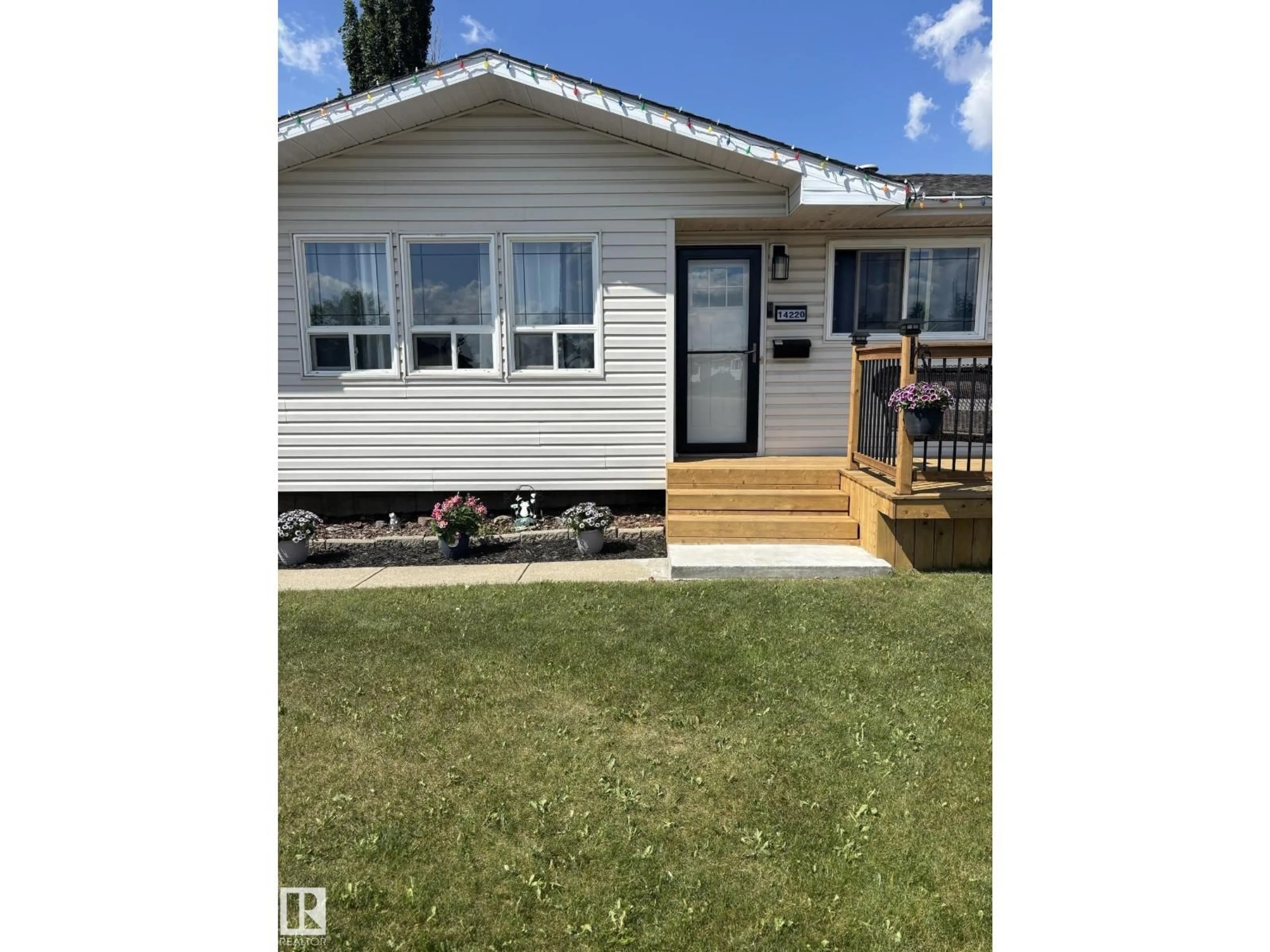 Home with vinyl exterior material, street for NW - 14220 57 ST, Edmonton Alberta T5A1M7