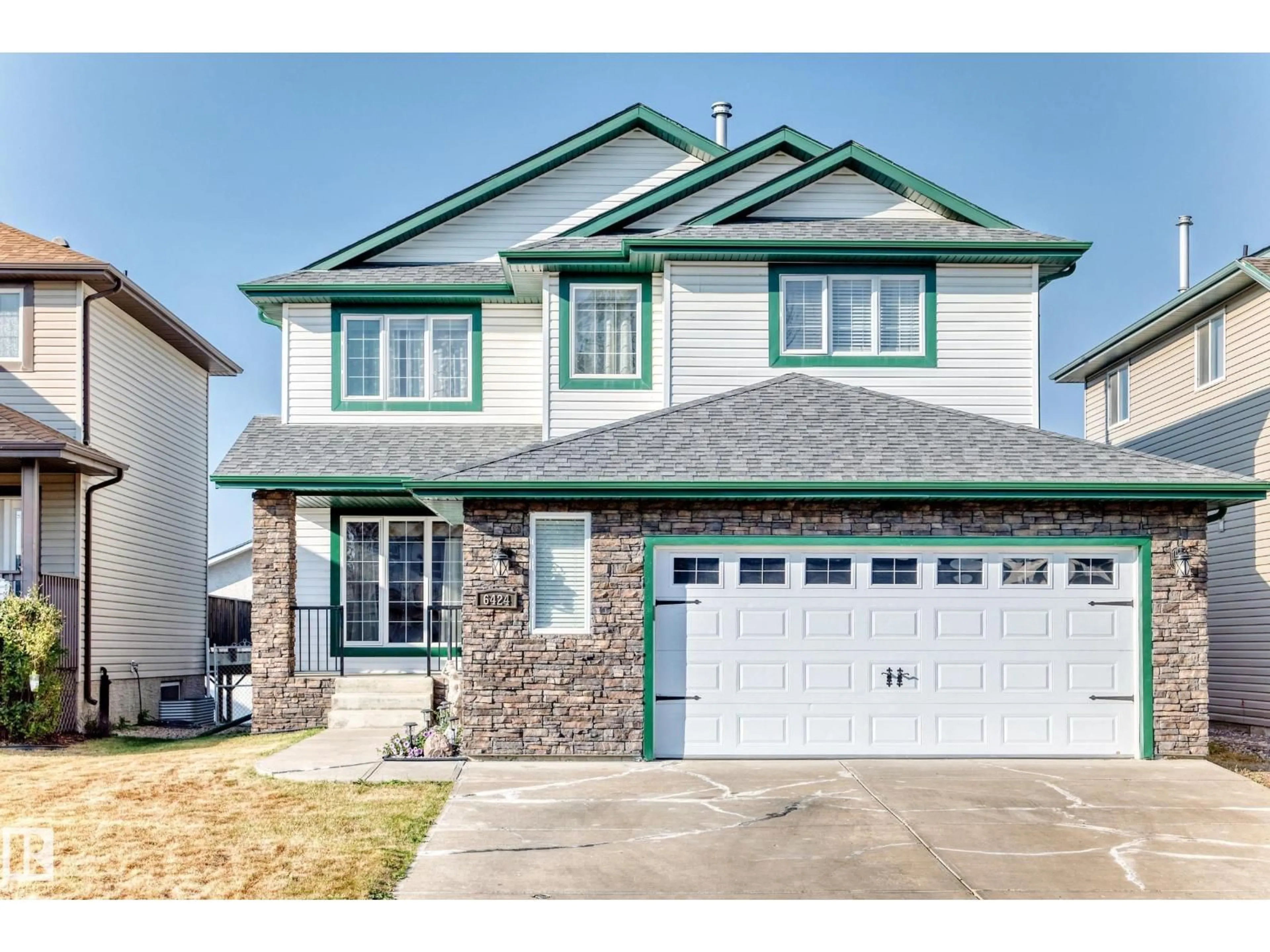 Home with vinyl exterior material, street for NW - 6424 164 AV, Edmonton Alberta T5Y3J2