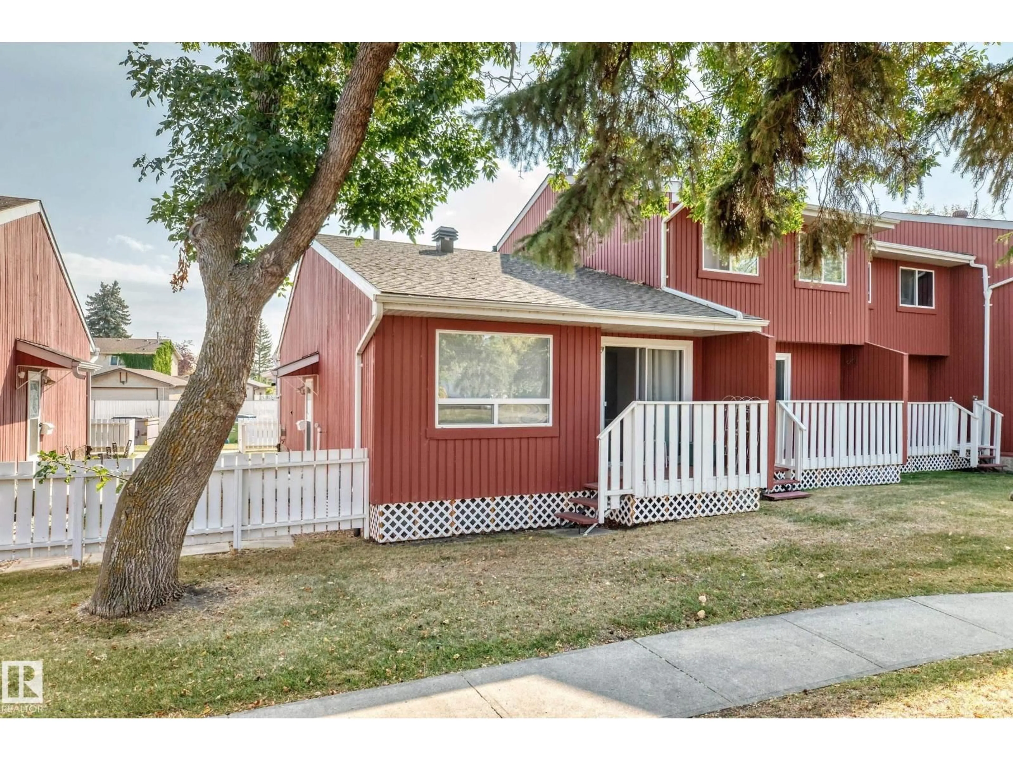 Home with vinyl exterior material, street for 10614 BEAUMARIS RD, Edmonton Alberta T5X3N4