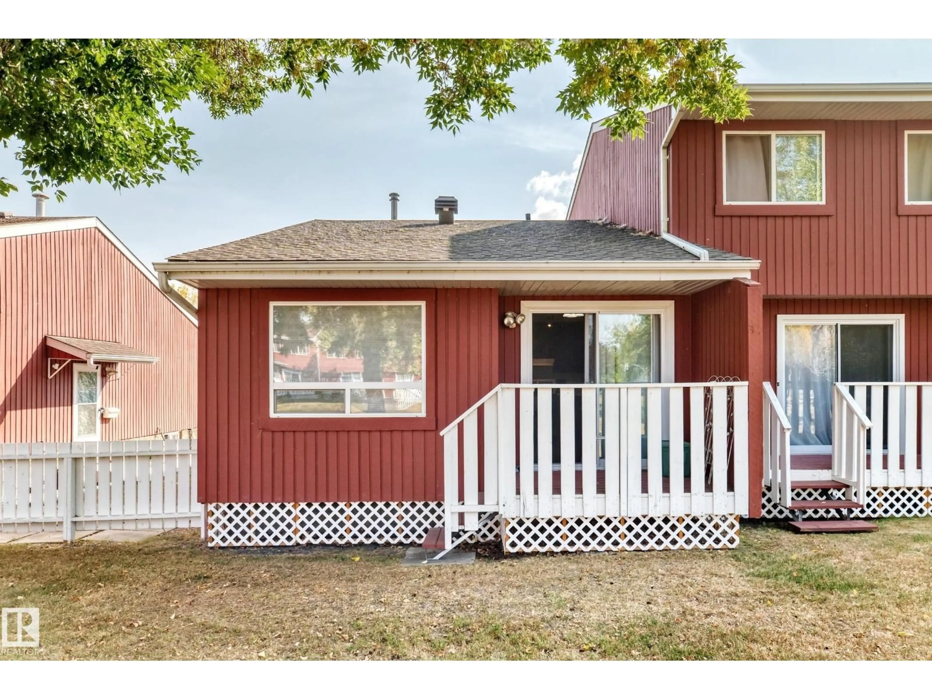 Home with vinyl exterior material, street for 10614 BEAUMARIS RD, Edmonton Alberta T5X3N4
