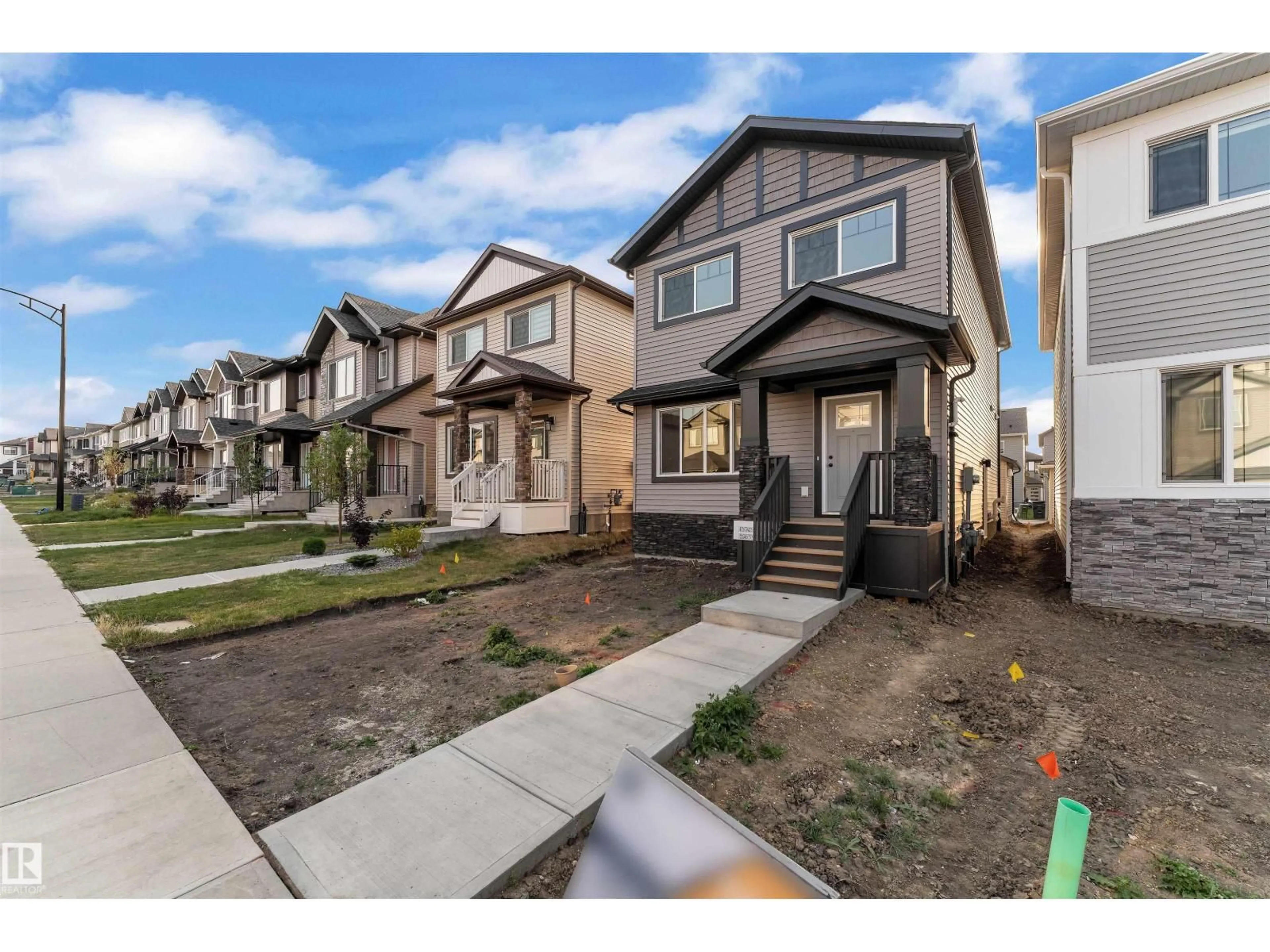 Home with vinyl exterior material, street for 1320 16 ST, Edmonton Alberta T6T2S3