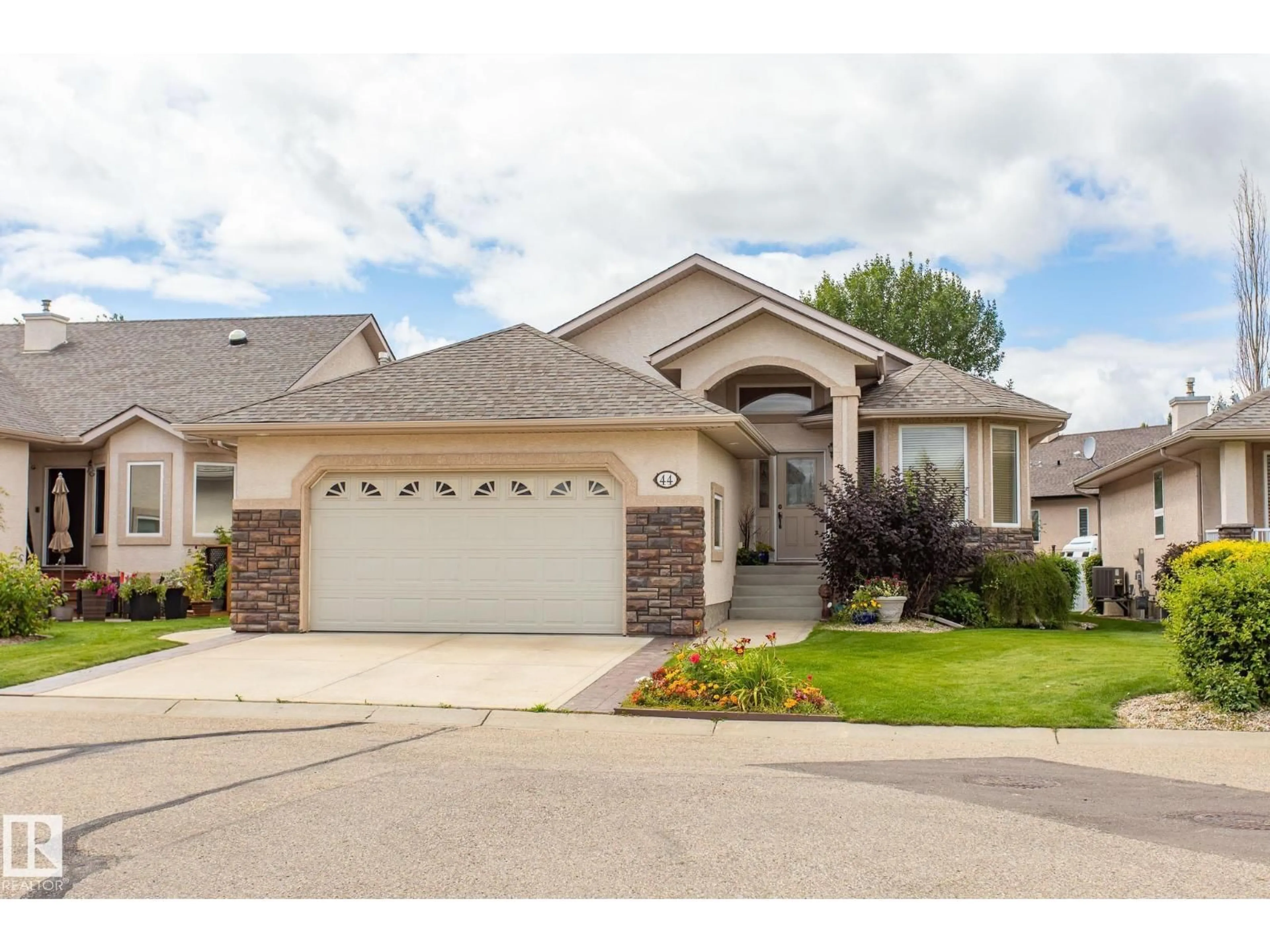 Home with vinyl exterior material, street for 44 173 AUSTIN DR, Red Deer Alberta T4R3J3