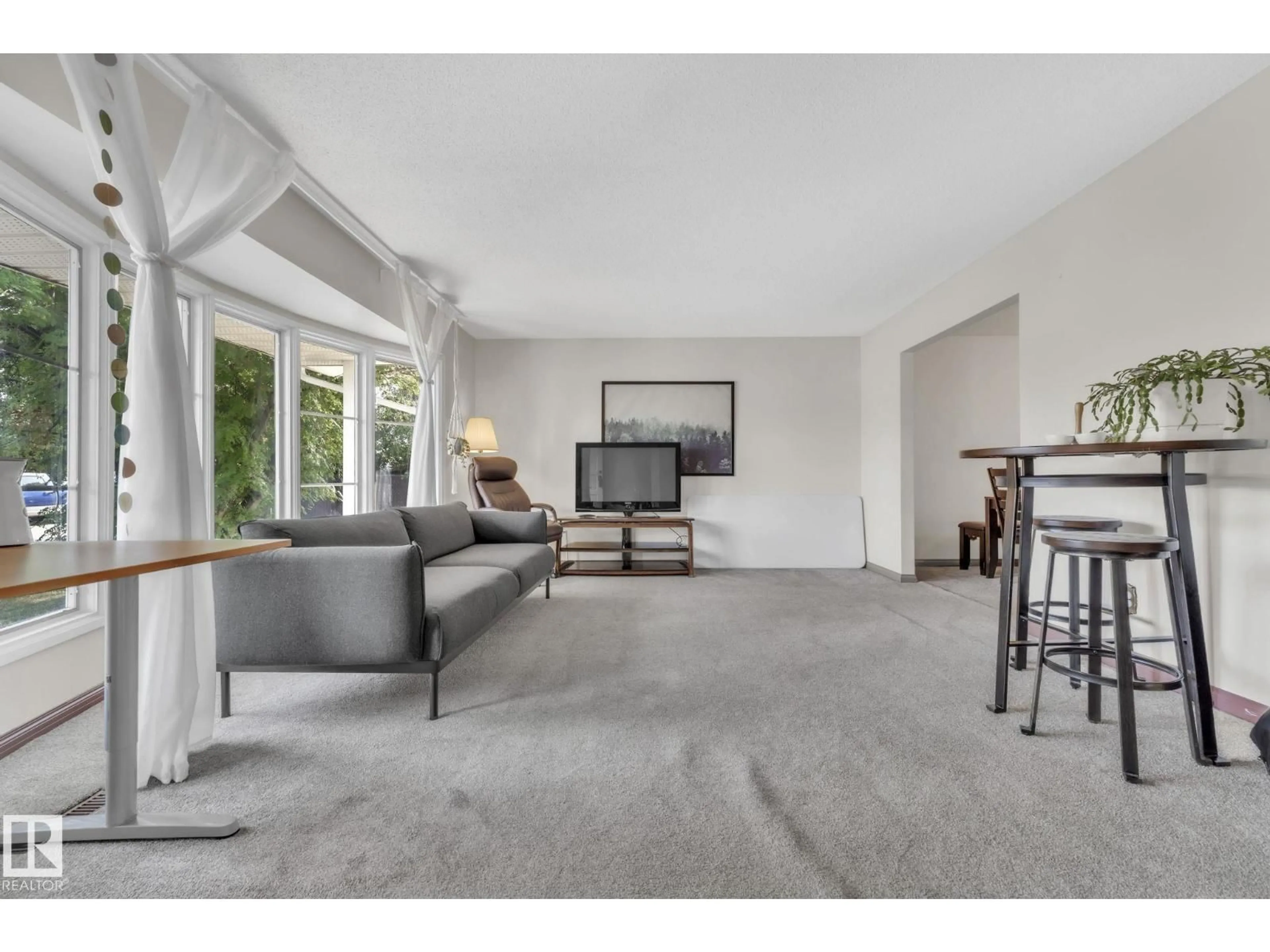 Living room with furniture, carpet floor for NW - 3116 67 ST, Edmonton Alberta T6K1L9