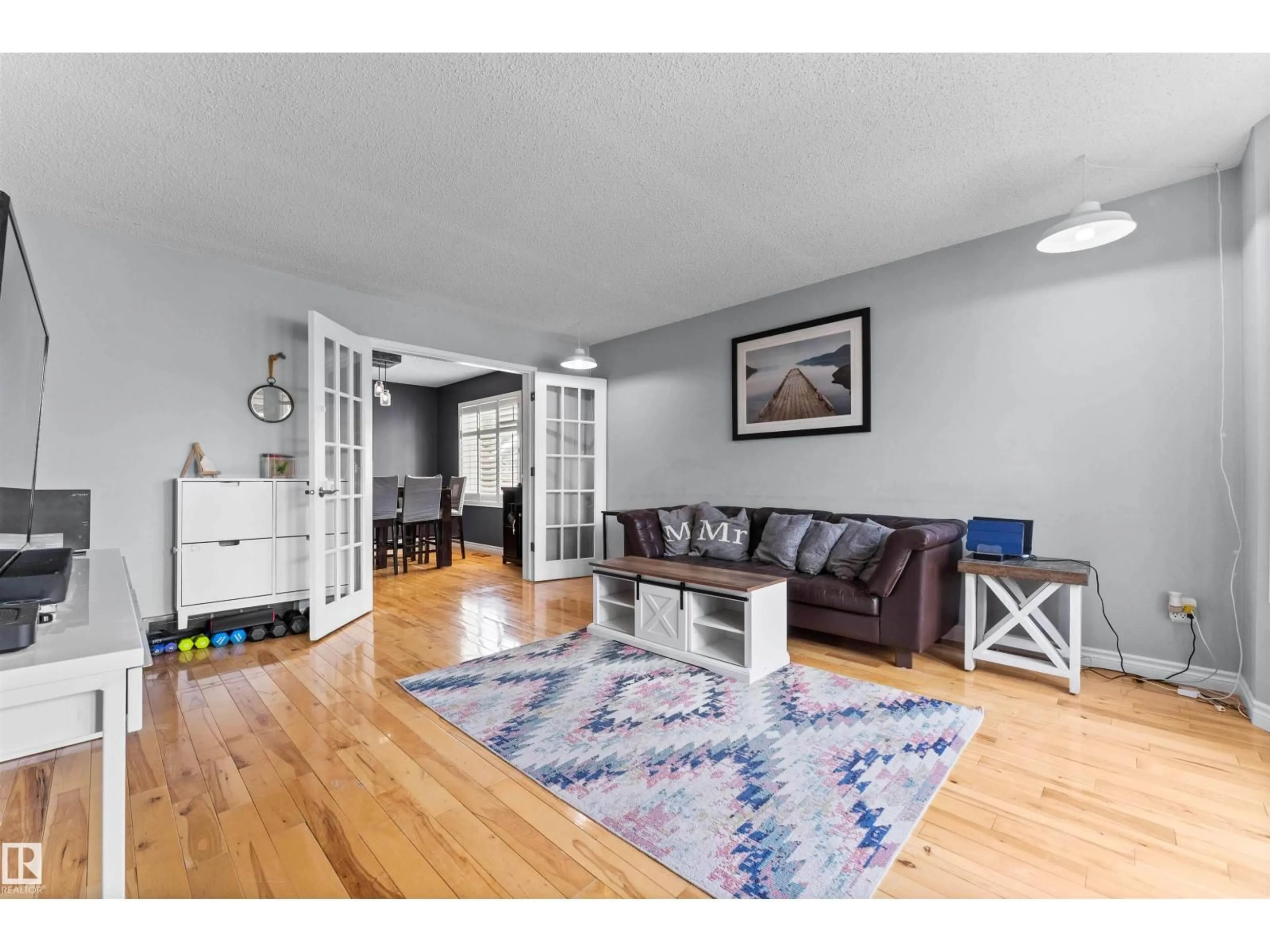 Living room with furniture, wood/laminate floor for NW - 15616 80 ST, Edmonton Alberta T5S2T5