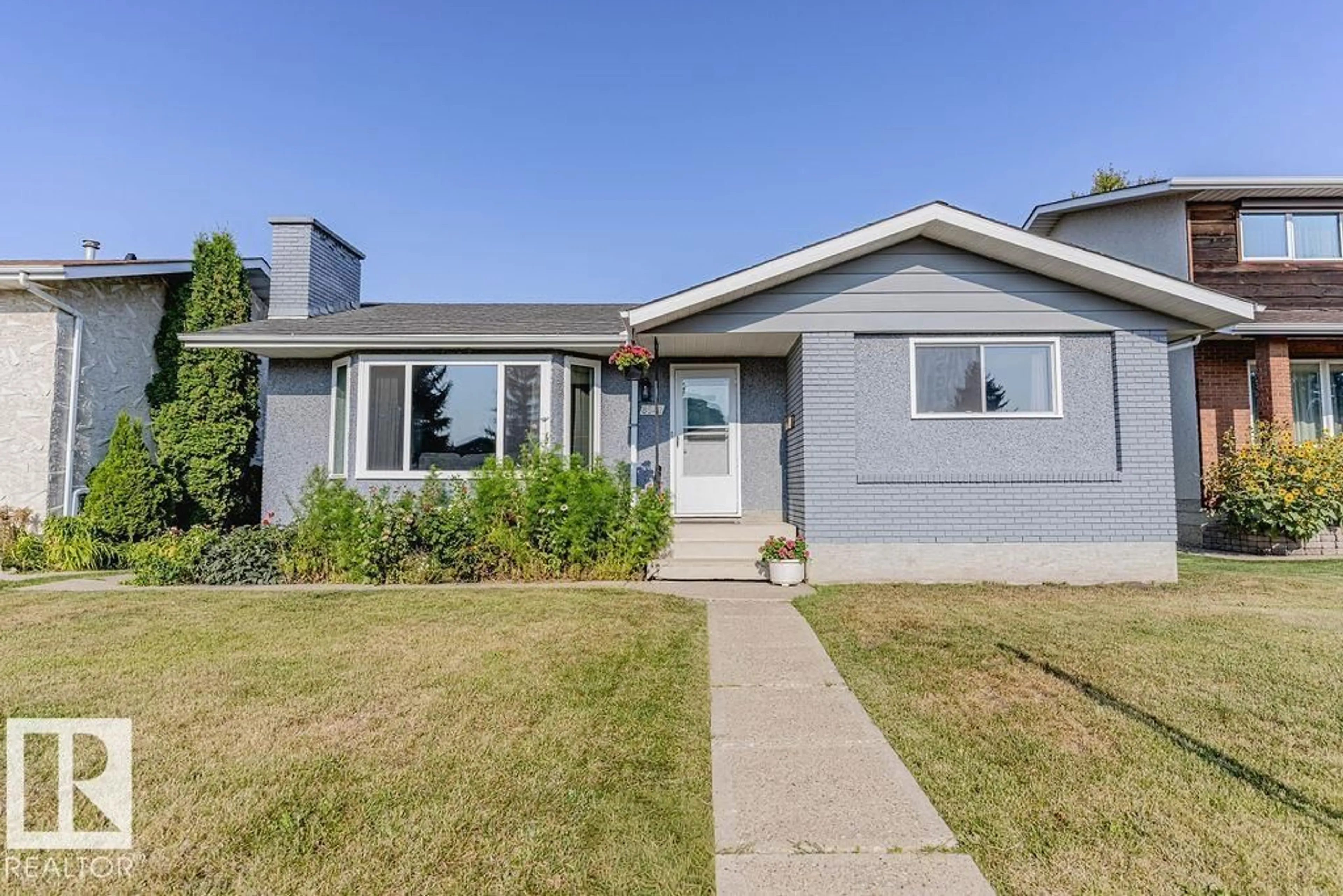 Home with vinyl exterior material, street for NW - 8542 10 AV, Edmonton Alberta T6K1X1