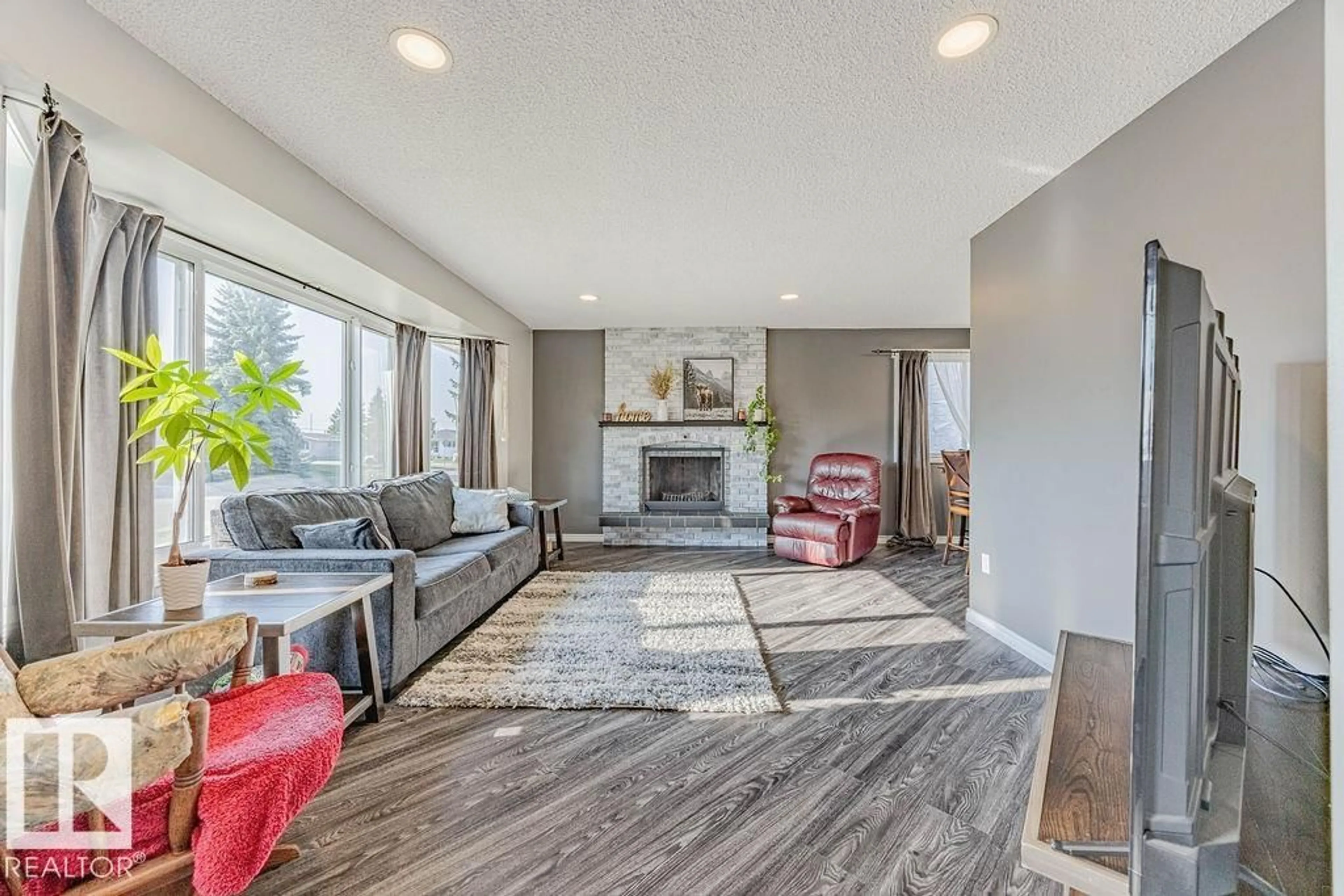 Living room with furniture, unknown for NW - 8542 10 AV, Edmonton Alberta T6K1X1